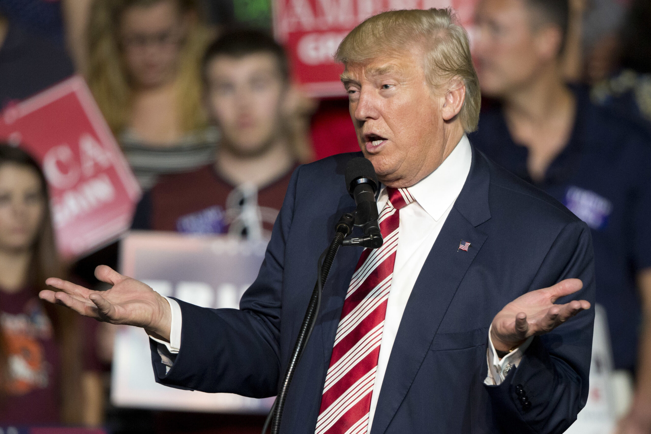 FILE – In this Sept. 24, 2016, file photo, Republican presidential candidate Donald Trump gestures during a rally in Roanoke, Va. Countless former Democrats in Ohio's blue-collar Mahoning Valley are transferring their adoration for late U.S. Rep. James A. Traficant Jr., D-Ohio, to Trump, while those who knew Traficant say similarities between him and Trump end at the populist bravado and outsized hair. (AP Photo/Steve Helber, File) (AP Photo/Steve Helber, File)