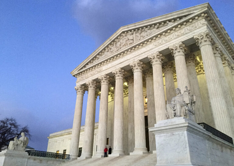 FILE - In this Feb. 13, 2016, file photo, people stand on the steps of the Supreme Court at sunset in Washington. The ideological direction of the Supreme Court is going to tip one way or the other after the election. (AP)