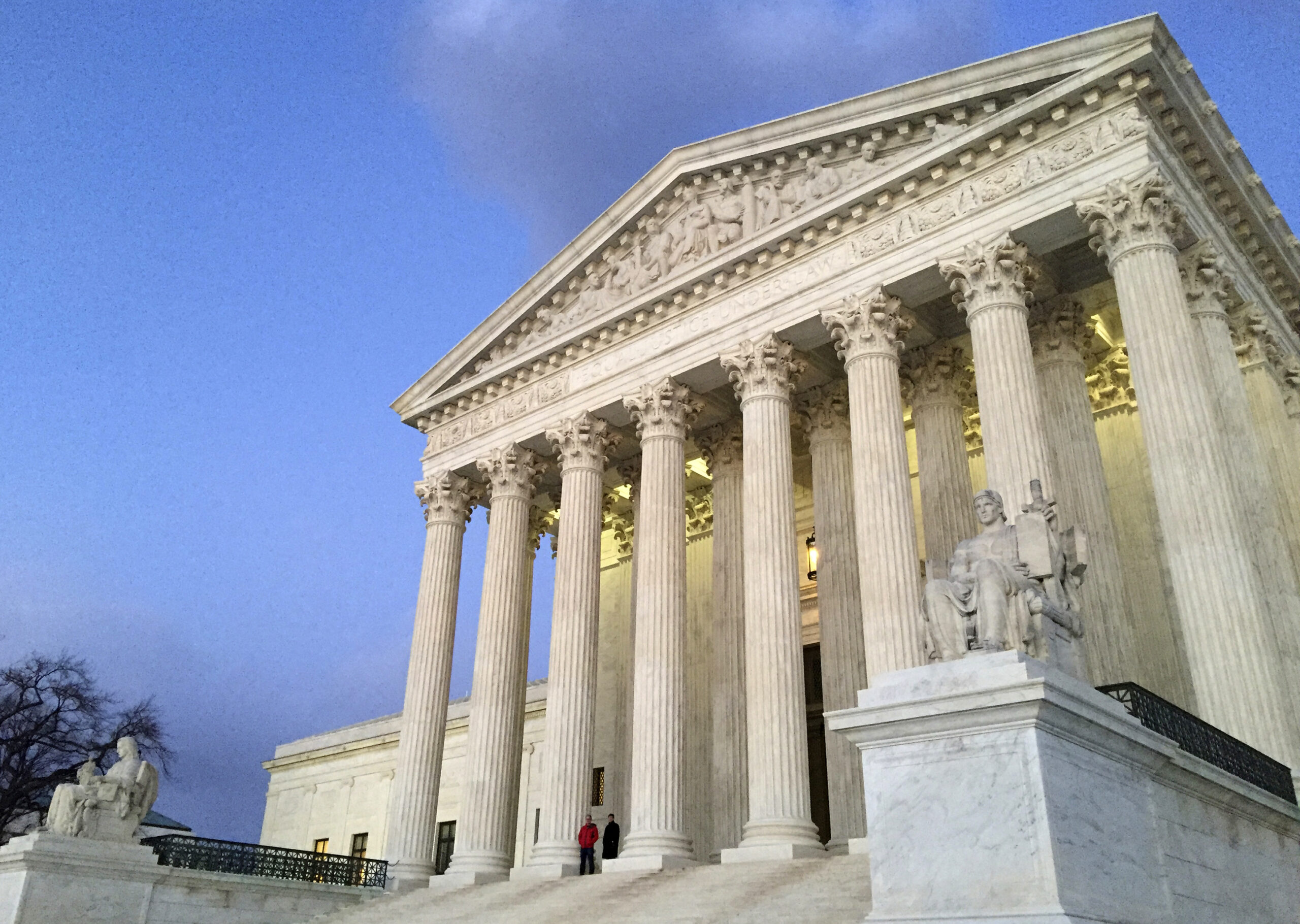 FILE - In this Feb. 13, 2016, file photo, people stand on the steps of the Supreme Court at sunset in Washington. The ideological direction of the Supreme Court is going to tip one way or the other after the election. (AP)
