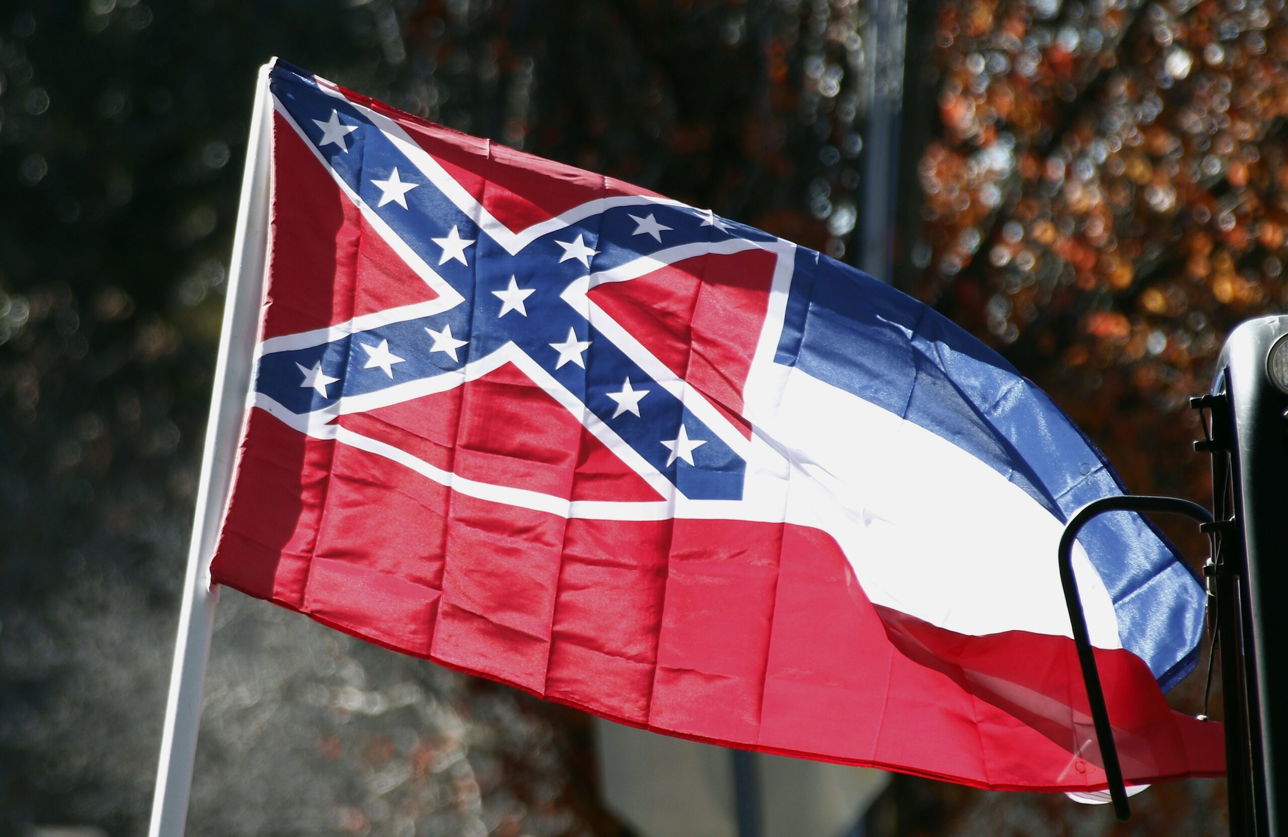 FILE - In this Tuesday, Jan. 19, 2016 file photo, a state flag of Mississippi is unfurled by Sons of Confederate Veterans and other groups on the grounds of the state Capitol in Jackson, Miss.An effort to erase the Confederate battle emblem from the Mississippi flag is failing because sponsors didn't gather enough signatures to put an initiative on the 2018 ballot. (AP Photo/Rogelio V. Solis, File) (AP)