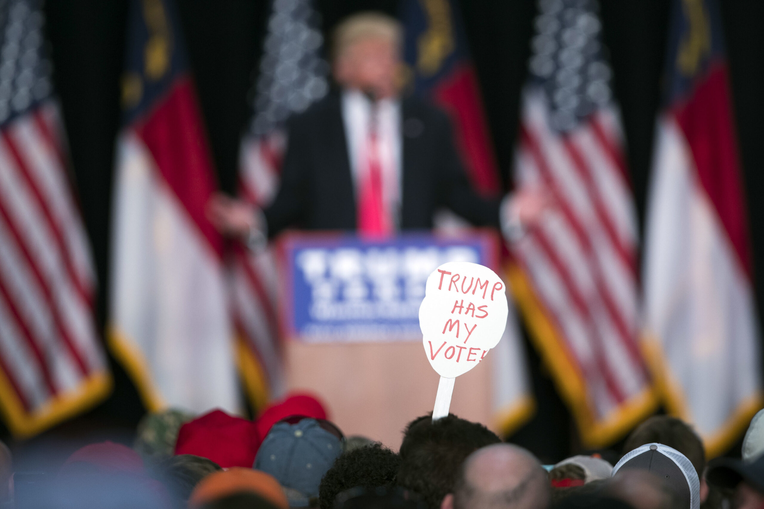 FILE - In this Monday, July 25, 2016 file photo, a supporter of Republican presidential candidate Donald Trump holds a sign during a campaign rally in Winston-Salem, N.C. A Kaiser Family Foundation-CNN poll released in September 2016 compared white college graduates and the white, black and Hispanic working class. Working-class whites were least likely to say that they're satisfied with their influence in the political process, that the federal government represents their views, and that they believe their children will achieve a better standard of living than themselves. (AP Photo/Evan Vucci) (AP)