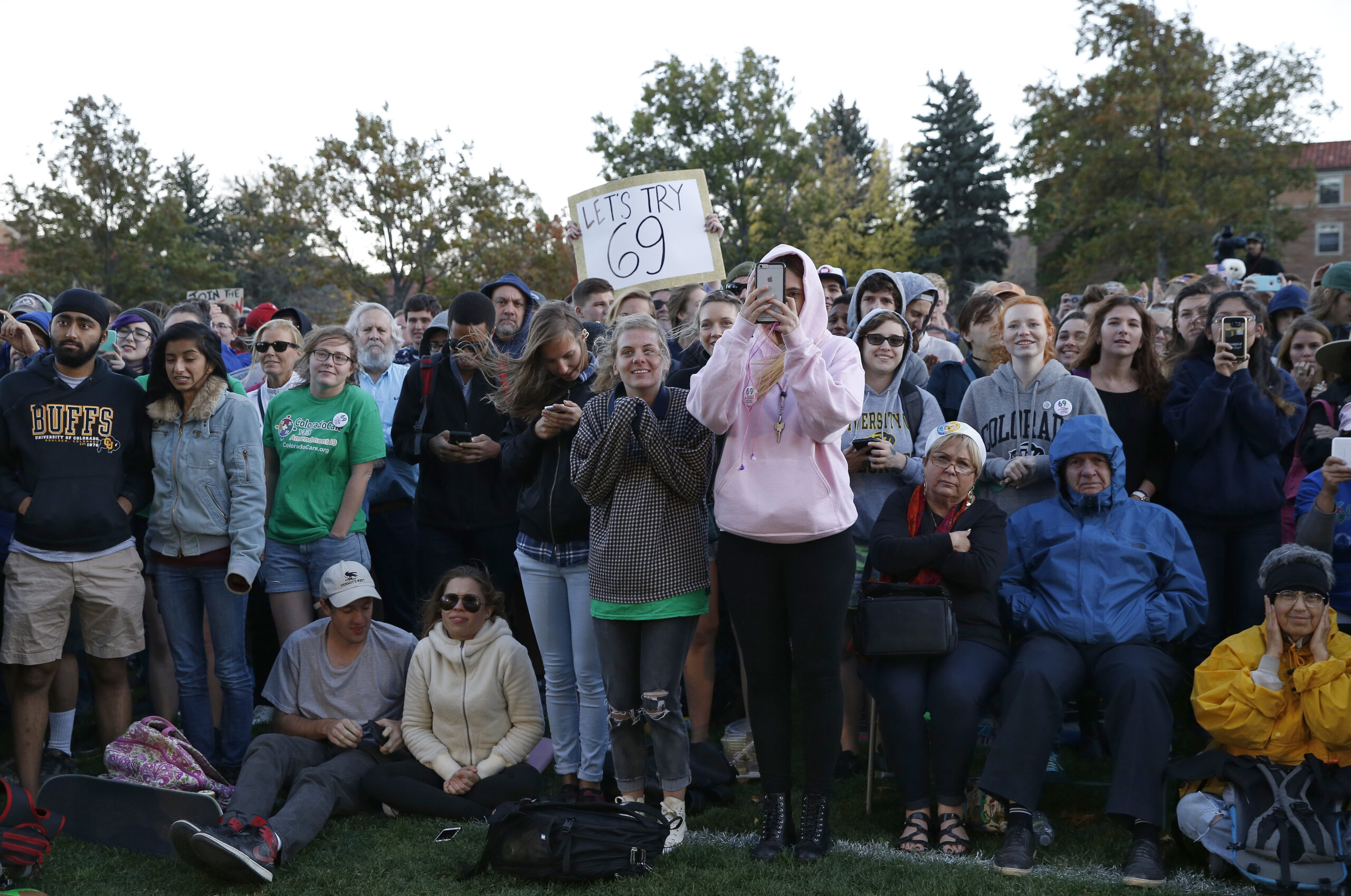 In this Oct. 17, 2016, photo, supporters applaud Sen. Bernie Sanders, I-Vt., who spoke at a rally in support of Colorado Amendment 69, a ballot measure to set up the nation's first universal health care system, on the campus of the University of Colorado, in Boulder. (AP Photo/Brennan Linsley)