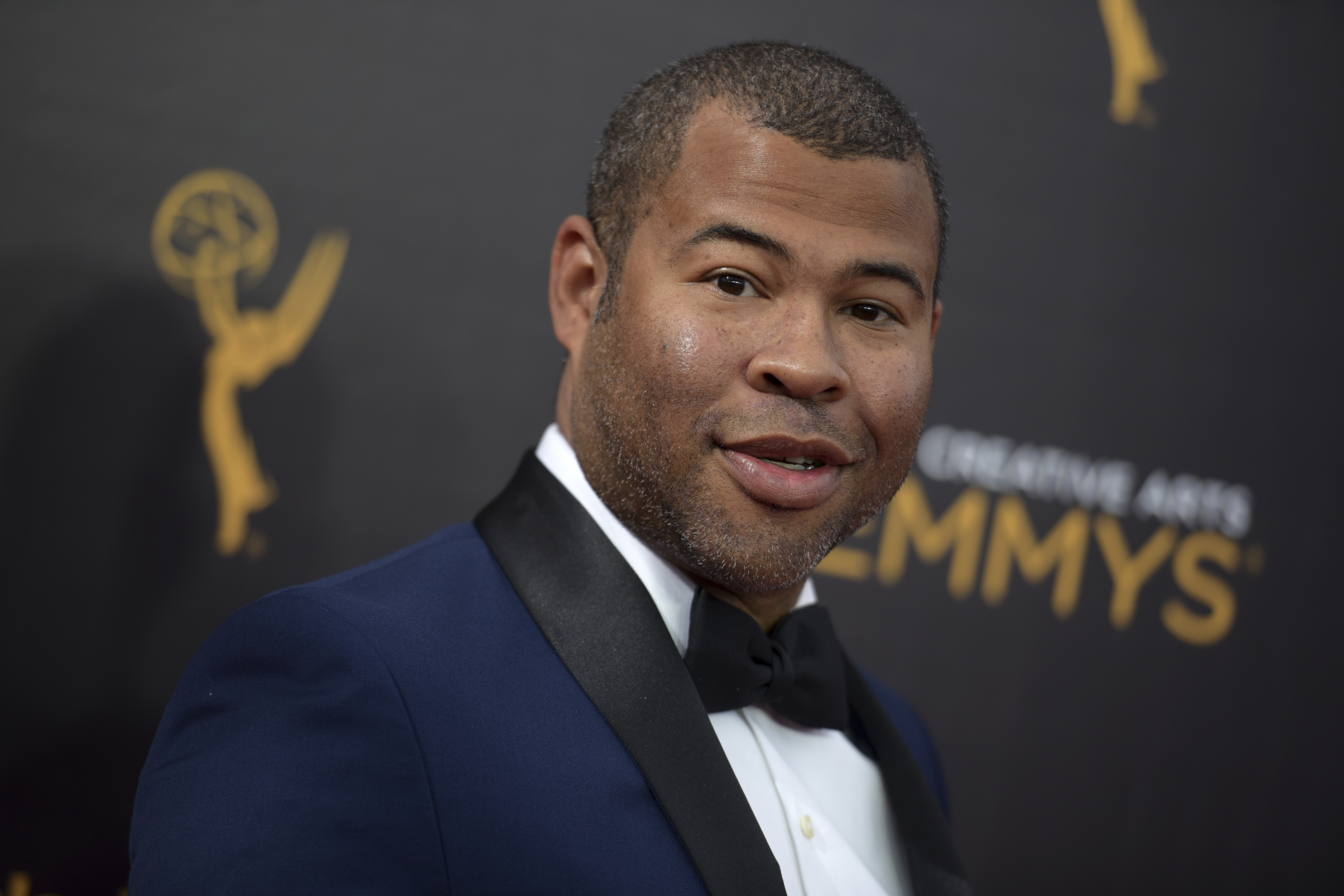 FILE - In this Sept. 11, 2016, file photo, Jordan Peele arrives at night two of the Creative Arts Emmy Awards in Los Angeles. The trailer for Peele's upcoming film, "Get Out," debuted online on Oct. 4, 2016. (Photo by Richard Shotwell/Invision/AP, File) (AP)
