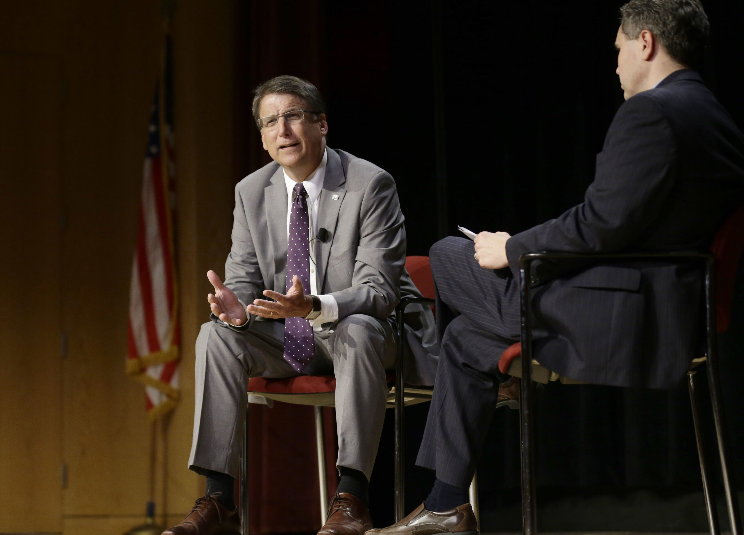 In this photo taken Wednesday, May 4, 2016 North Carolina Gov. Pat McCrory, left, make remarks concerning House Bill 2 while speaking during a government affairs conference in Raleigh, N.C. The North Carolina governor's race is everything voters anticipated it would be: expensive attack ads and barbed debates before what's essentially a referendum on the state's recent rightward tilt under Republican rule, particularly the state law limiting protections for LGBT people _ known as House Bill 2. (AP Photo/Gerry Broome, File) (AP)