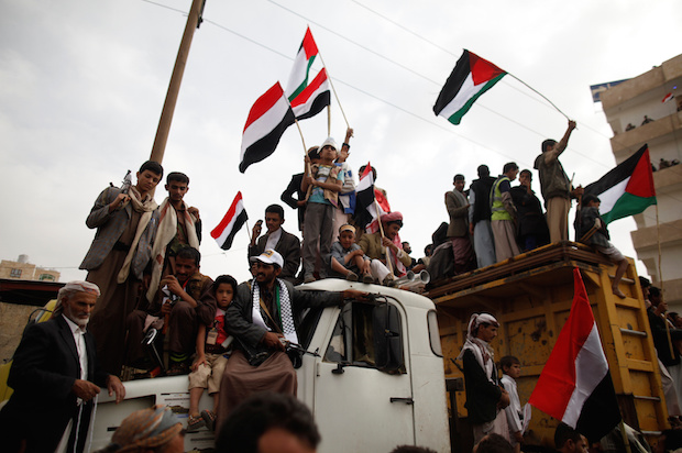 Supporters of Yemen's Houthi rebels stand atop a truck as they demonstrate to mark the annual Al-Quds Day in the capital Sana'a, on July 1, 2016 (Reuters/Khaled Abdullah)