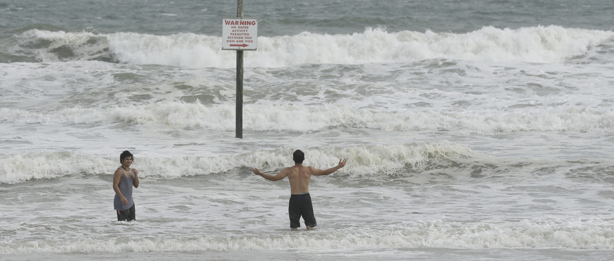 A pair of swimmers take advantage of the high surf from winds associated with Hurricane Matthew Thursday, Oct. 6, 2016, in Daytona Beach, Fla. (AP)