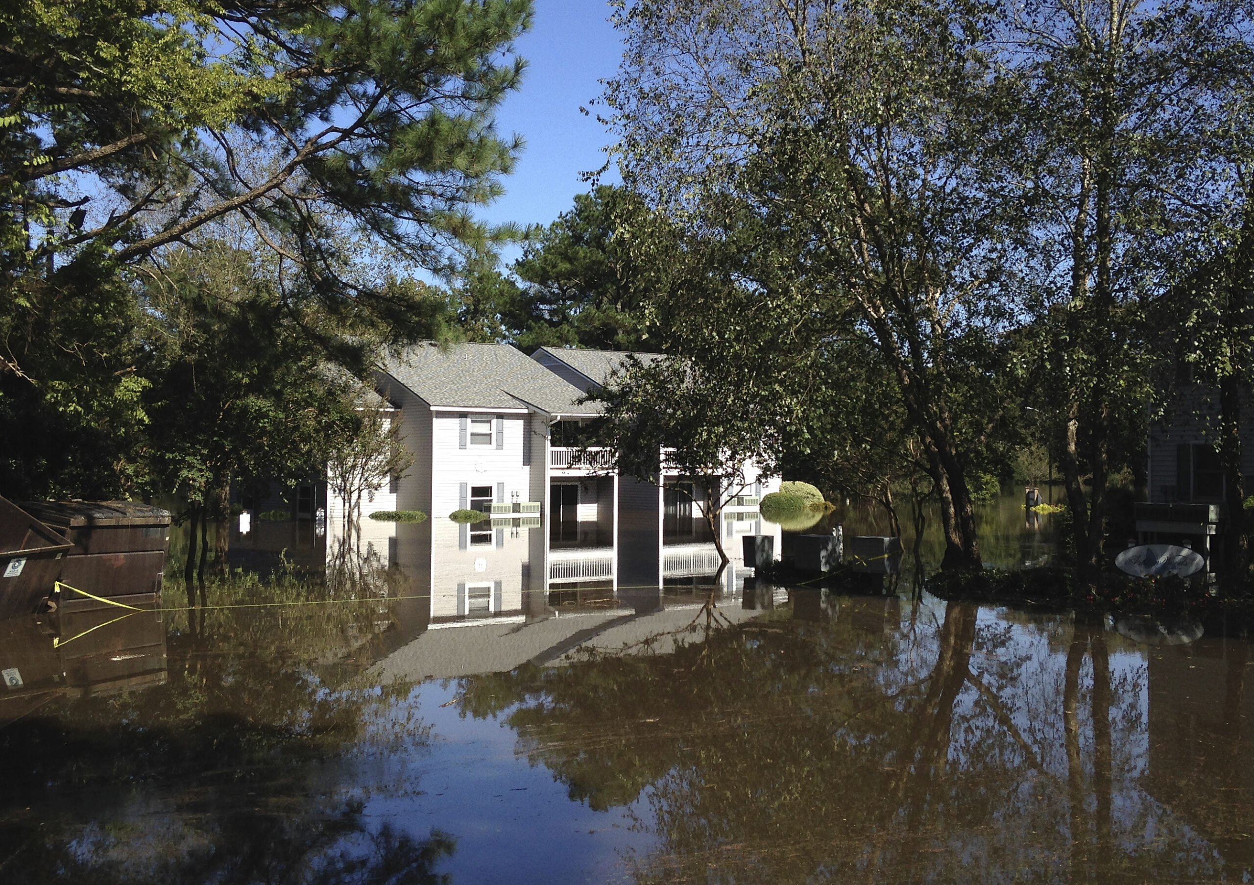 An apartment complex near the Tar River in Greenville, N.C., is seen surrounded by floodwaters on Wednesday, Oct. 12, 2016. Many houses and apartments near the river were already taking on water a day before the river swollen by Hurricane Matthew was forecast to crest on Thursday. (AP Photo/Jonathan Drew) (AP)