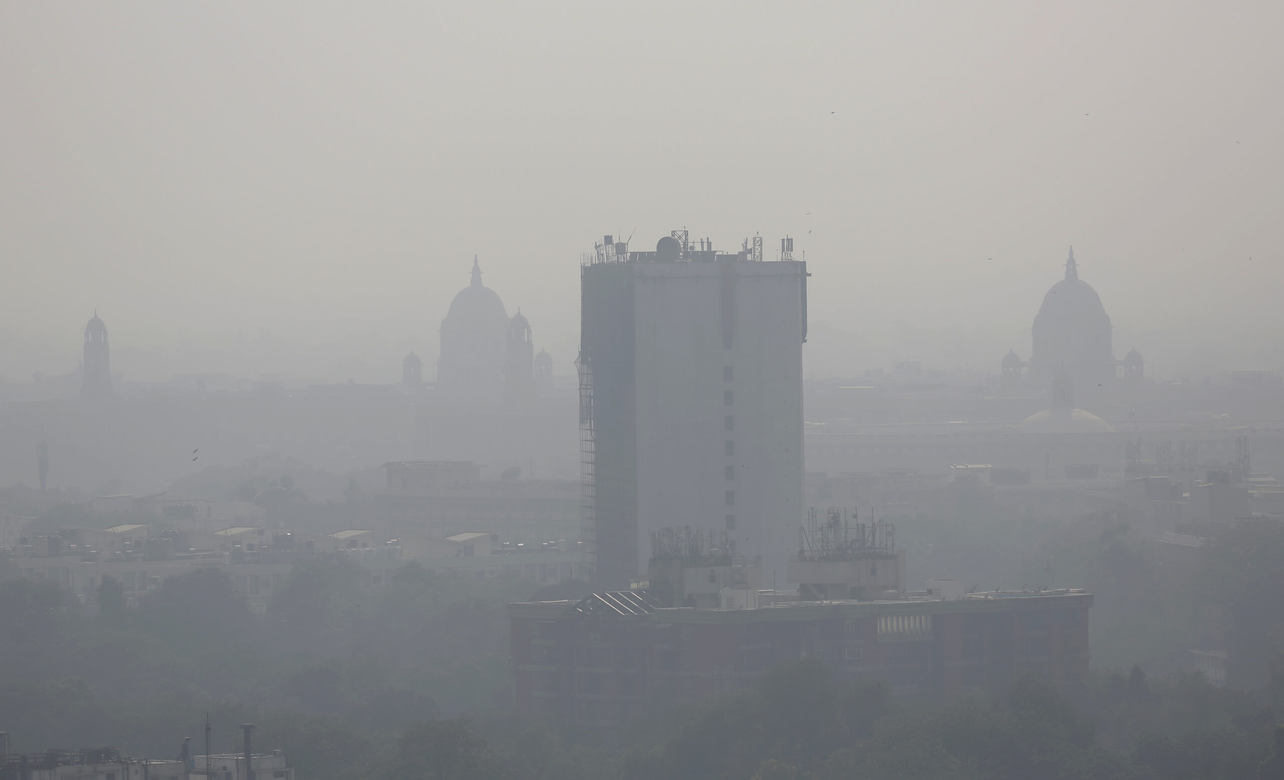 In this photo taken Friday, Oct. 28, 2016, a layer of smog envelops the city skyline before Diwali festival in New Delhi, India. As north Indian cities enter the season of high air pollution, a new report is warning about the dangers to children.  (AP Photo/Altaf Qadri) (AP)