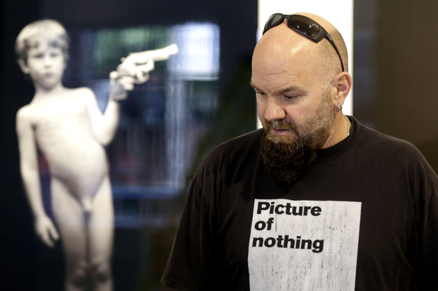 Jonathan Ferrara oversees the installation of the show "Guns in the Hands of Artists" (AP/Gerald Herbert)