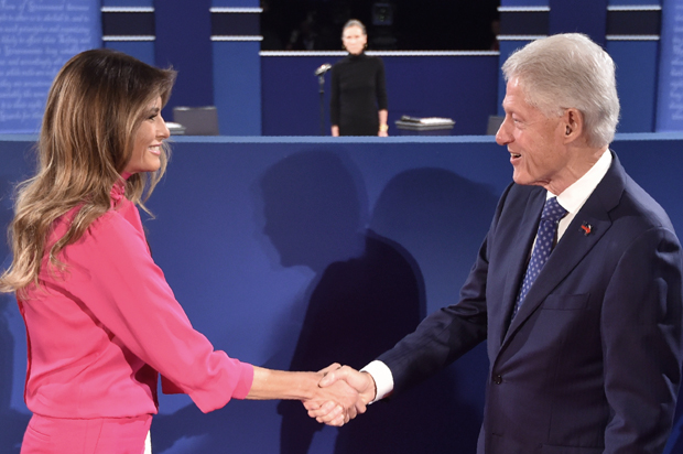 Bill Clinton greets Melania Trump before the start of the second presidential debate in St. Louis, Missouri on October 9, 2016. (Getty/Paul J. Richards)