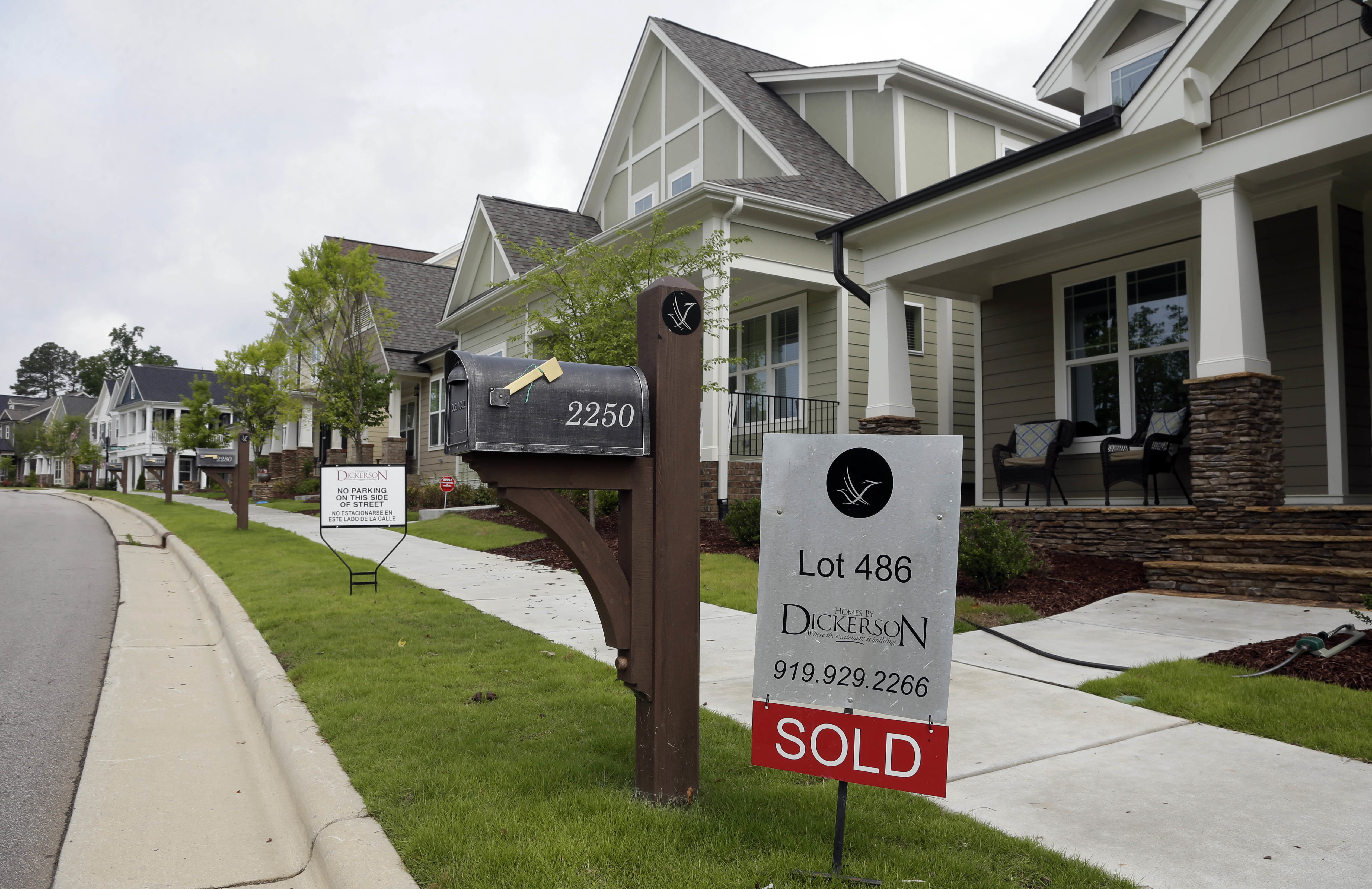FILE - In this Tuesday, June 9, 2015, file photo, a "Sold" sign is displayed in the yard of a newly-constructed home in the Briar Chapel community in Chapel Hill, N.C. On Thursday, Oct. 27, 2016, Freddie Mac reports on the week's average U.S. mortgage rates. (AP Photo/Gerry Broome, File) (AP)