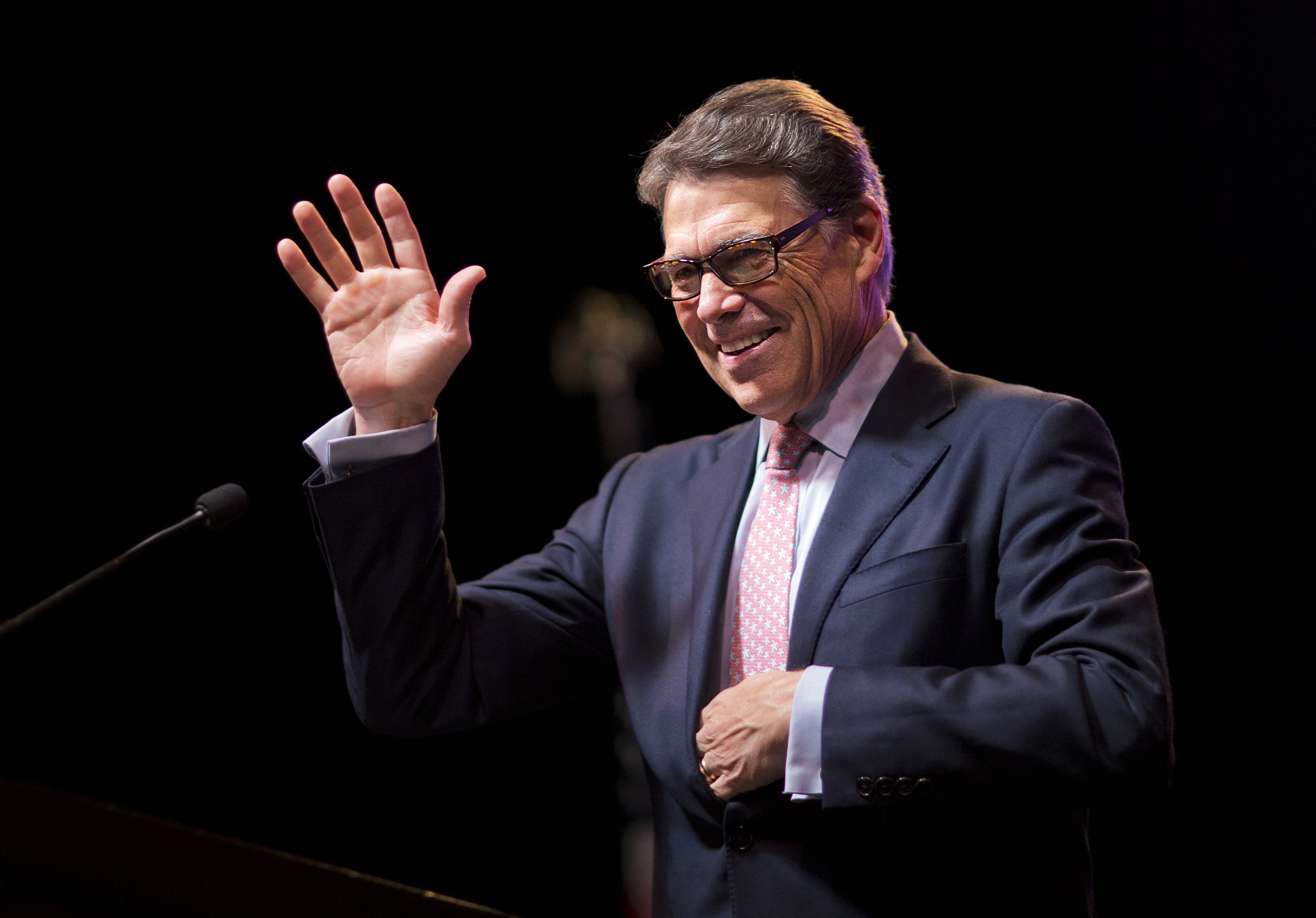 FILE - In this Aug. 7, 2015, file photo, former Republican presidential candidate and former Texas Gov. Rick Perry, waves to the crowd as he steps to the podium to speak at the RedState Gathering in Atlanta. Perry has joined the board of a stem cell firm where he underwent experimental back surgery before running for president in 2011, a procedure that didn't calm the chronic pain that the Republican later blamed for his "oops moment" and other infamous gaffes that sunk his once-promising campaign. (AP Photo/David Goldman, File) (AP)