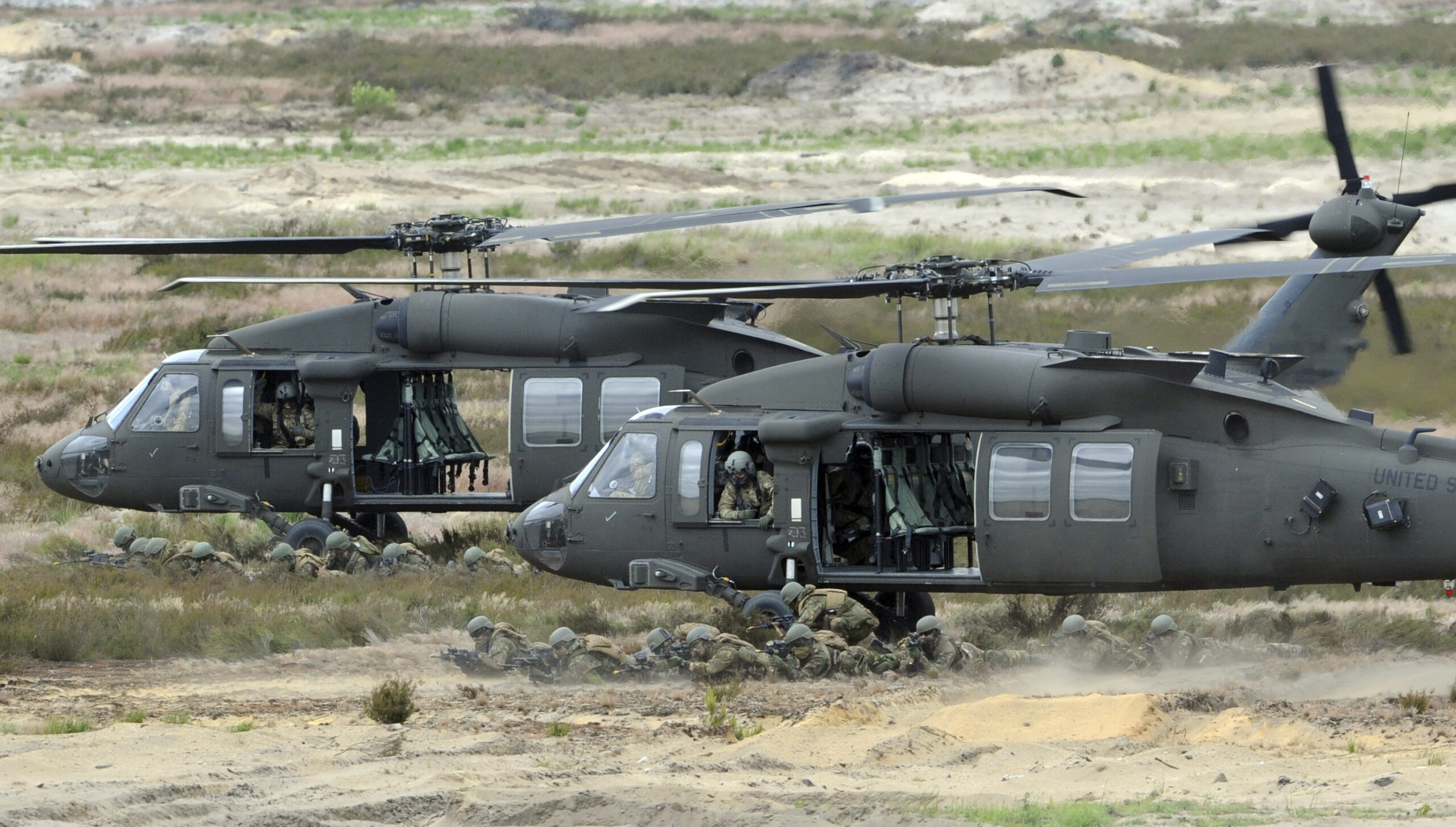 FILE -- In this June 18, 2015 file photo U.S. Army Black Hawk helicopters support soldiers during the NATO Noble Jump exercise on a training range near Swietoszow Zagan, Poland. Polish leaders say the country is buying Polish-made Black Hawk helicopters as it modernizes the army. The announcement comes days after Poland scrapped plans to buy 50 French-made military helicopters from Airbus Helicopters for 3.14 billion euros (US dollar 3.5 billion). (AP Photo/Alik Keplicz, file) (AP)