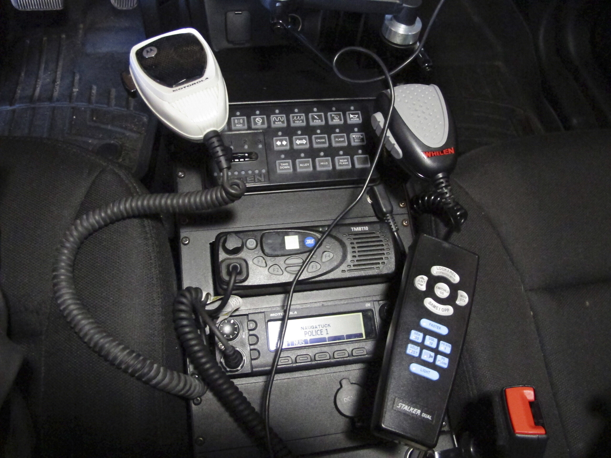 In this Thursday, Oct. 6, 2016 photo, a radio in a police cruiser sits between the front seats in Naugatuck, Conn. (AP)