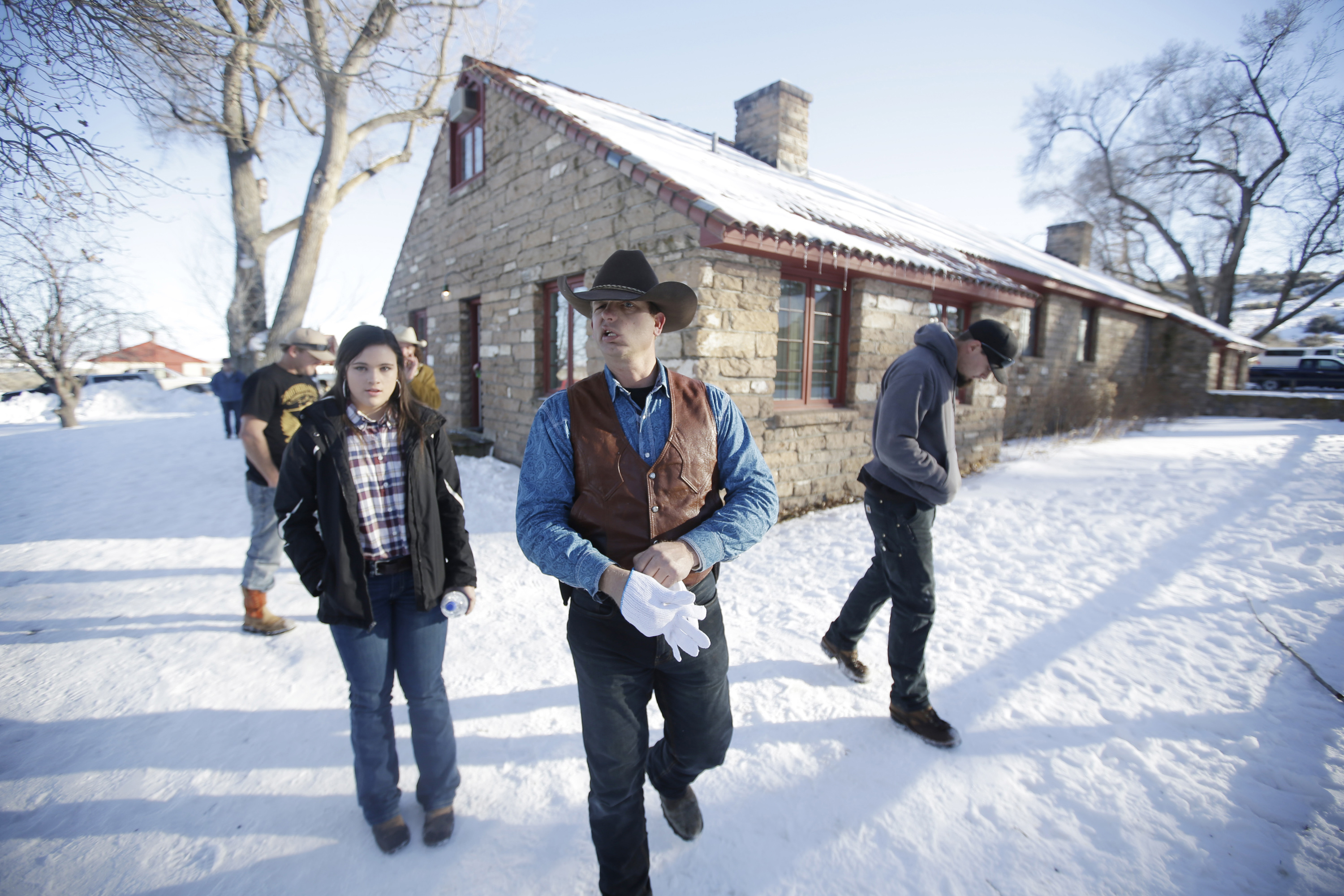 FILE - In this Jan. 8, 2016, file photo, Ryan Bundy, center, one of the sons of Nevada rancher Cliven Bundy, walks through the Malheur National Wildlife Refuge near Burns, Ore. (AP)