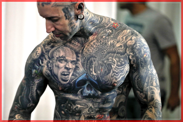 A man shows his tattoos during the International Tattoo Convention Bucharest 2016 in Bucharest, Romania, Sunday, Oct. 16, 2016. Prominent tattoo artists from across the world displayed their skills in the Romanian capital over the weekend. (AP Photo/Vadim Ghirda) (AP)