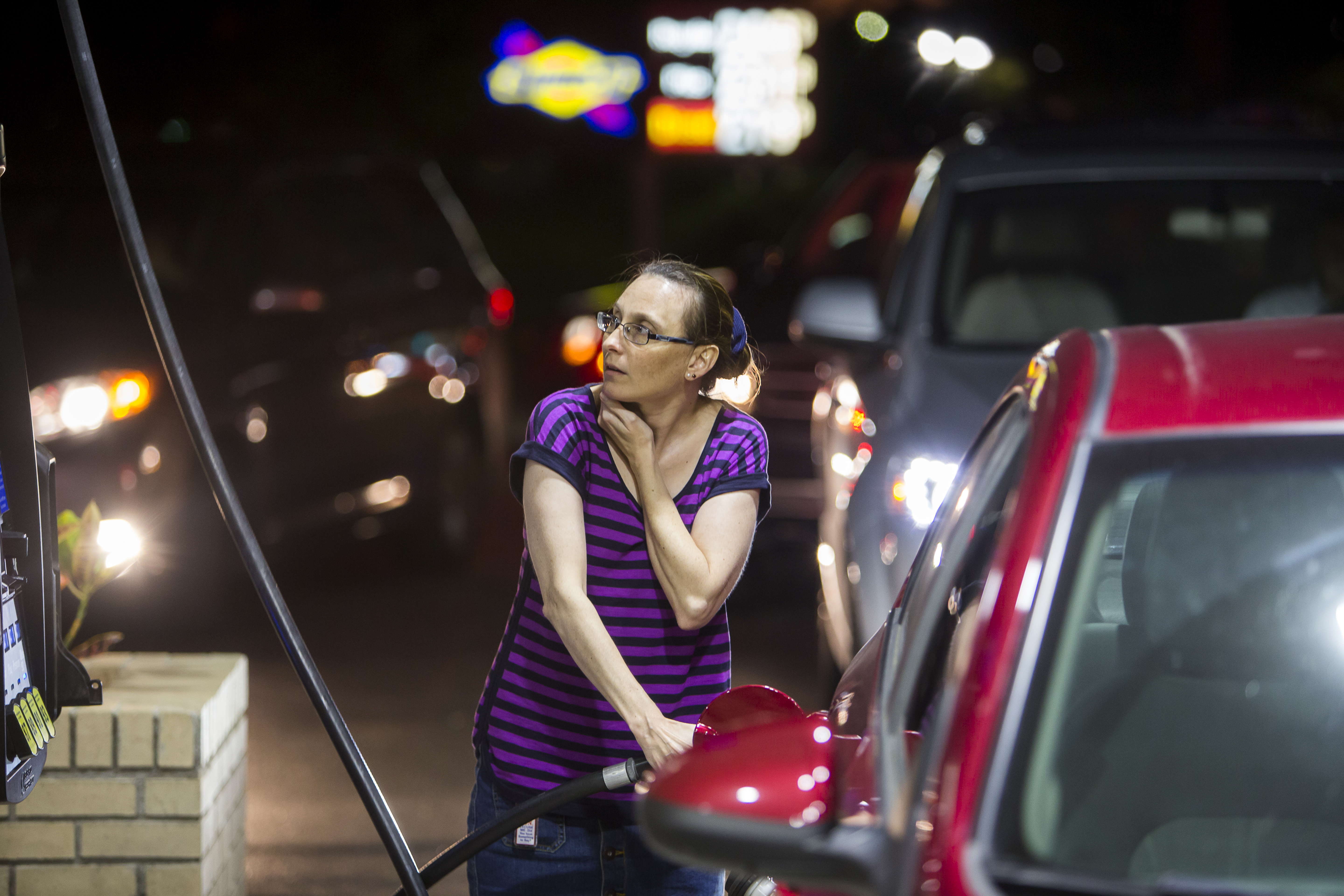Beth Johnson fills up her car after waiting in line at a Sunoco gas station  in advance of Hurricane Matthew in Mt. Pleasant, S.C., Tuesday, Oct. 4, 2016. Hurricane Matthew is expected to affect the South Carolina coast by the weekend. Gov. Nikki Haley announced Tuesday that, unless the track of the storm changes, the state will issue an evacuation order Wednesday to help get 1 million people inland from the coast.  (AP Photo/Mic Smith) (AP)