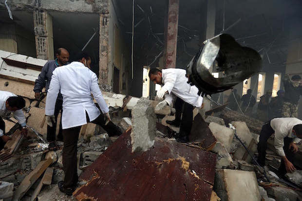 Medics search for bodies under the rubble of a funeral hall that was bombed by the Saudi-led coalition in Sana'a, Yemen on Saturday, Oct. 8, 2016 (AP/Osamah Abdulrhman)