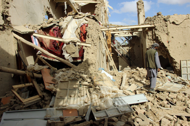 An Afghan man inspects a house destroyed during Thursday’s clashes between Afghan security forces and Taliban in Kunduz, Afghanistan, on November 4, 2016 (Reuters/Nasir Wakif)