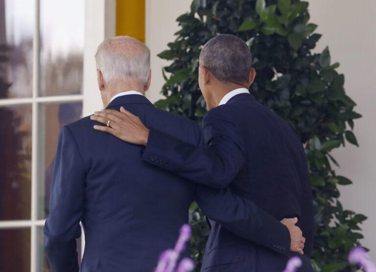 President Barack Obama and Vice President Joe Biden, with their arms on each other, walk back to the Oval Office of the White House in Washington, Wednesday, Nov. 9, 2016, after the president spoke about the election in the Rose Garden. (AP)