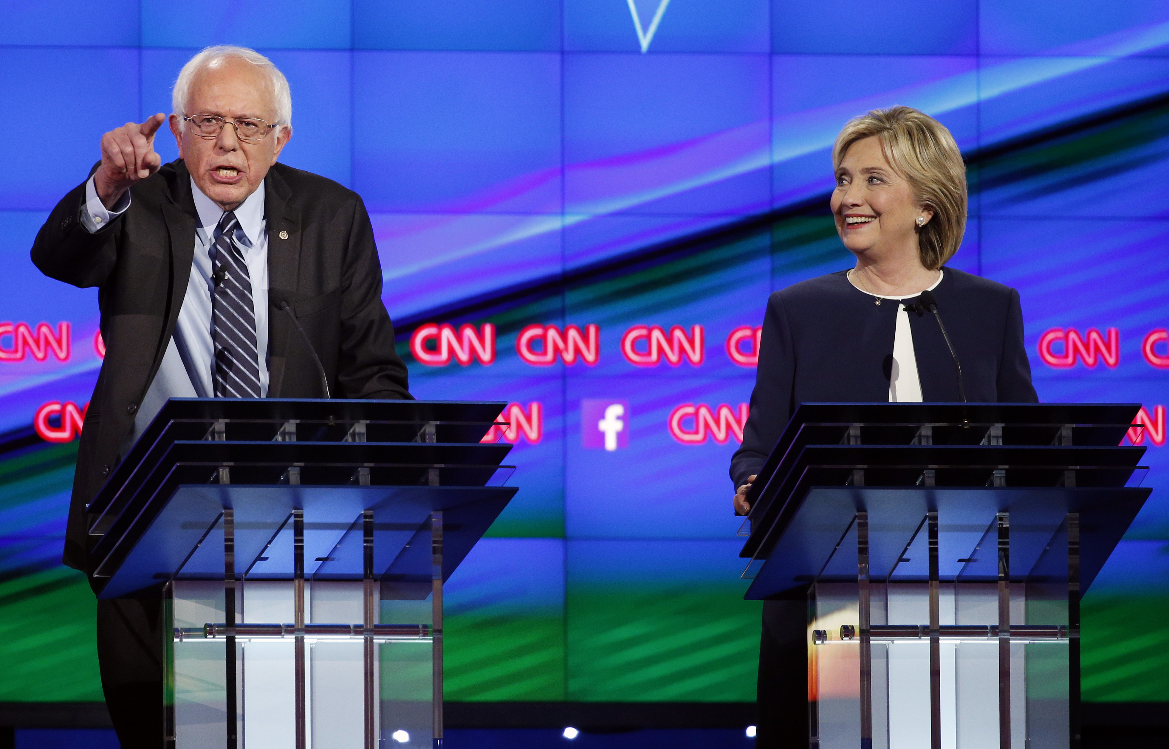 FILE - In this Tuesday, Oct. 13, 2015, file photo, Sen. Bernie Sanders, of Vermont, left, speaks as Hillary Clinton watches during a CNN Democratic presidential debate in Las Vegas. (AP Photo/John Locher, File) (AP)