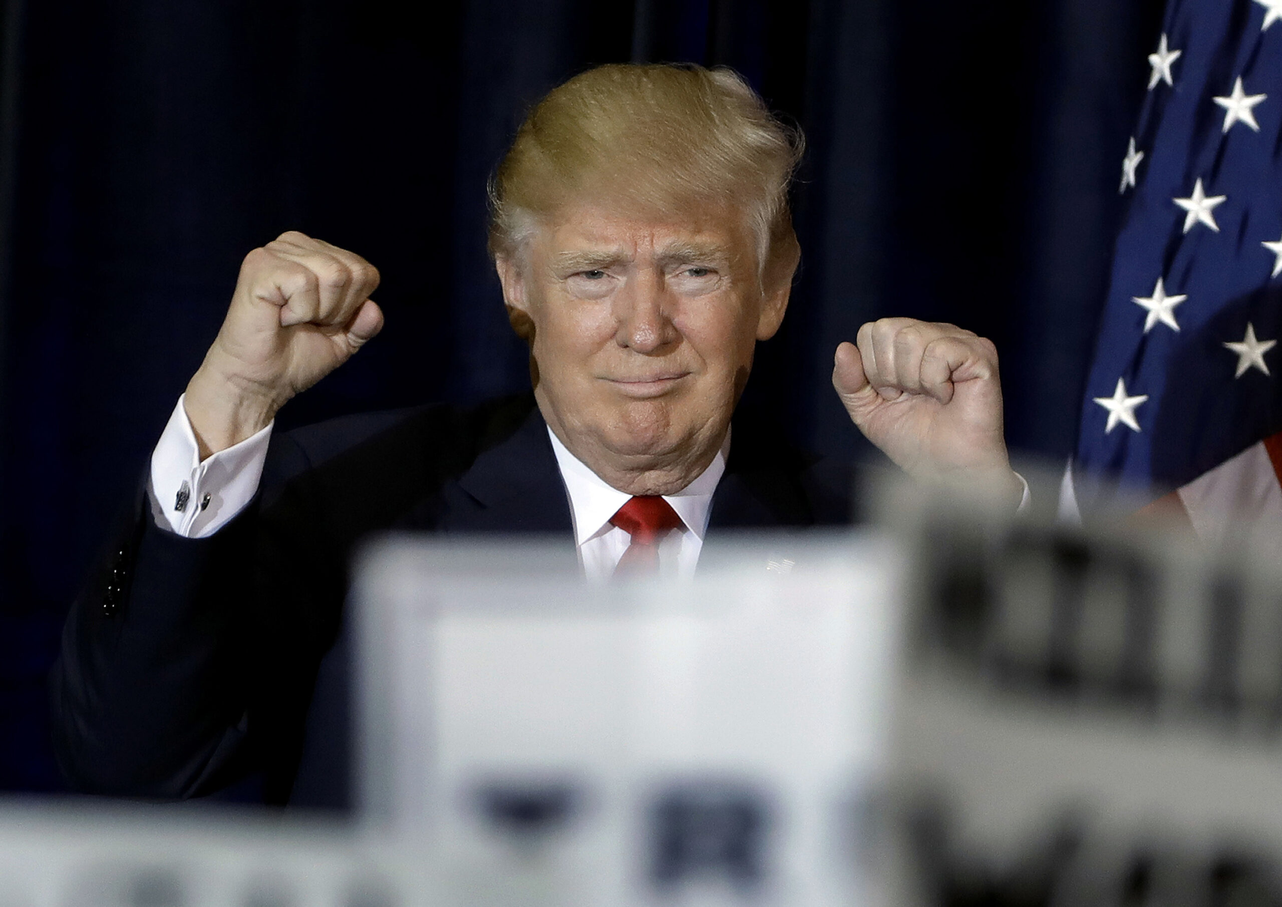 Republican presidential candidate Donald Trump pumps his fists as he takes the stage during a campaign rally Saturday, Nov. 5, 2016, in Tampa, Fla. (AP)