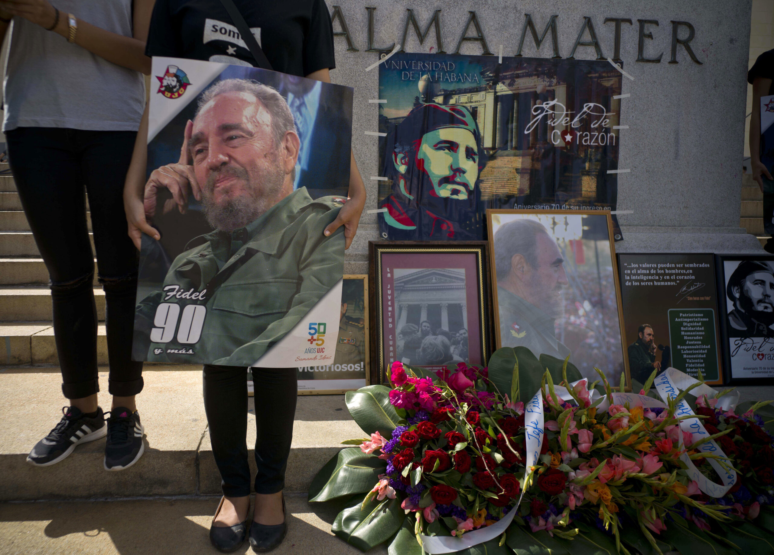 People with images of Fidel Castro gather one day after his death in Havana, Cuba, Saturday, Nov. 26, 2016. (AP)