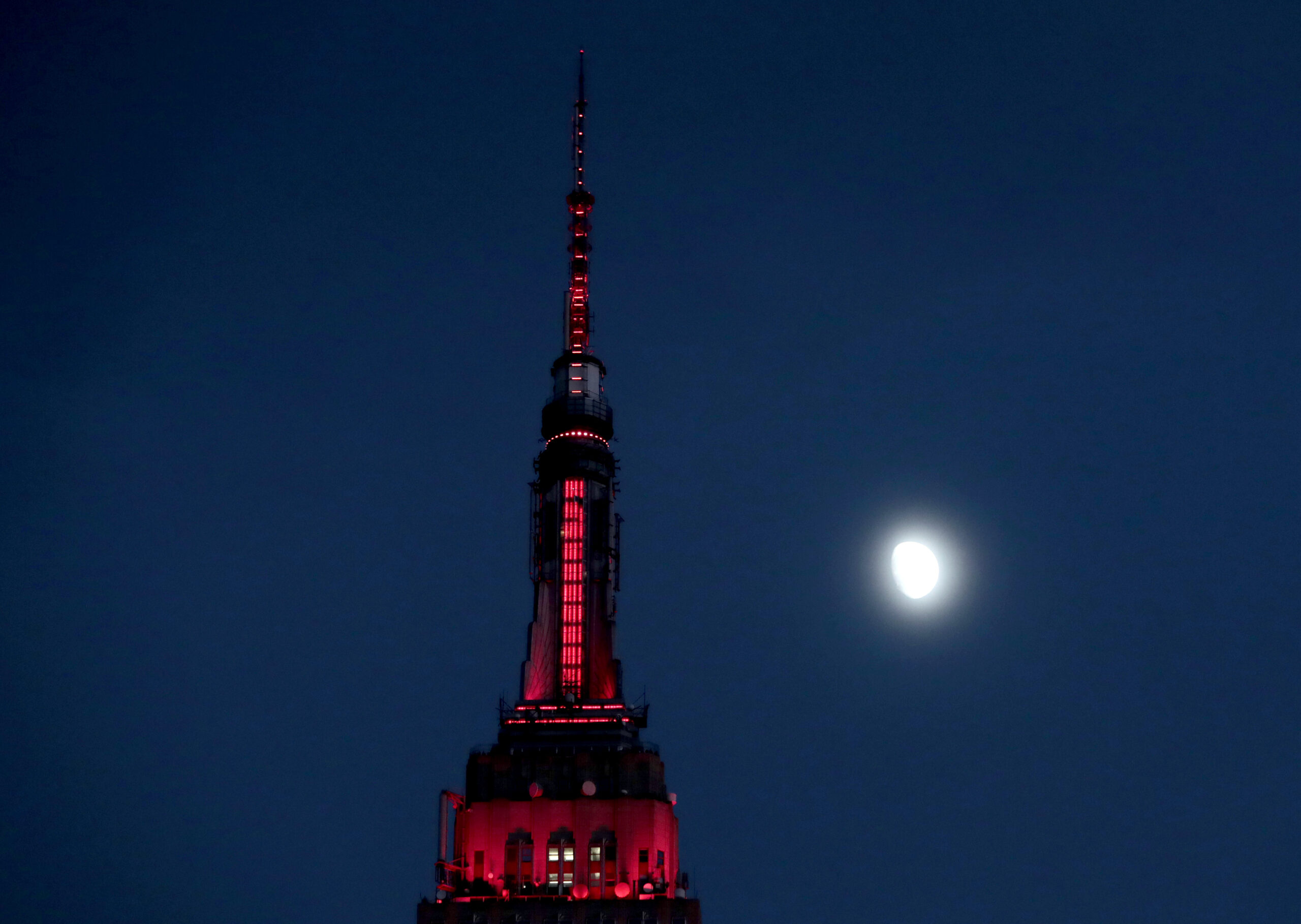FILE - In this Thursday, Nov. 10, 2016, file photo, the moon is seen in its waxing gibbous stage as it rises near the Empire State Building, in New York. On Tuesday, Nov. 15, 2016, the Federal Reserve Bank of New York issues its Empire State manufacturing index for November. (AP Photo/Julio Cortez, File) (AP)