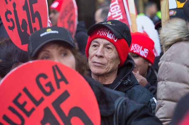 Demonstrators demanding an increase in the minimum wage to $15-dollars-per-hour prepare to march in the streets on April 14, 2016 in Chicago, Illinois (Getty/Scott Olson)