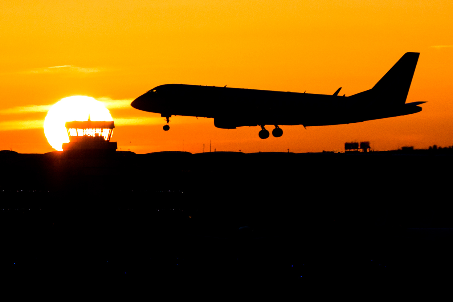 A plane lands during sunrise at the airport in Duesseldorf, Germany, Friday, Nov. 25,  2016.  Lufthansa pilots will continue their strike at least until Saturday. (Marcel Kusch/dpa via AP) (AP)