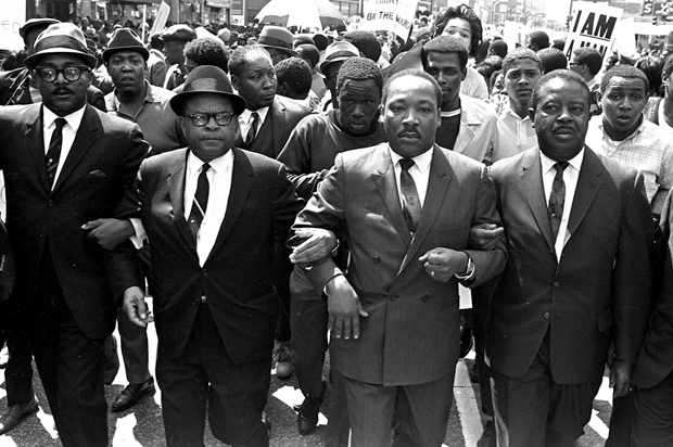 The Rev. Ralph Abernathy, right, and Bishop Julian Smith, left, flank Dr. Martin Luther King, Jr., during a civil rights march in Memphis, Tenn., March 28, 1968. (AP/Jack Thornell)