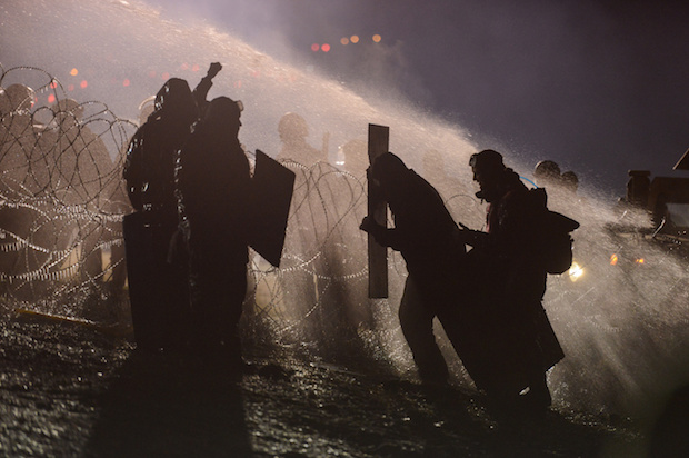 Police use a water cannon against Dakota Access pipeline protesters in the freezing cold, near the Standing Rock Indian Reservation, North Dakota, November 20, 2016 (Reuters/Stephanie Keith)