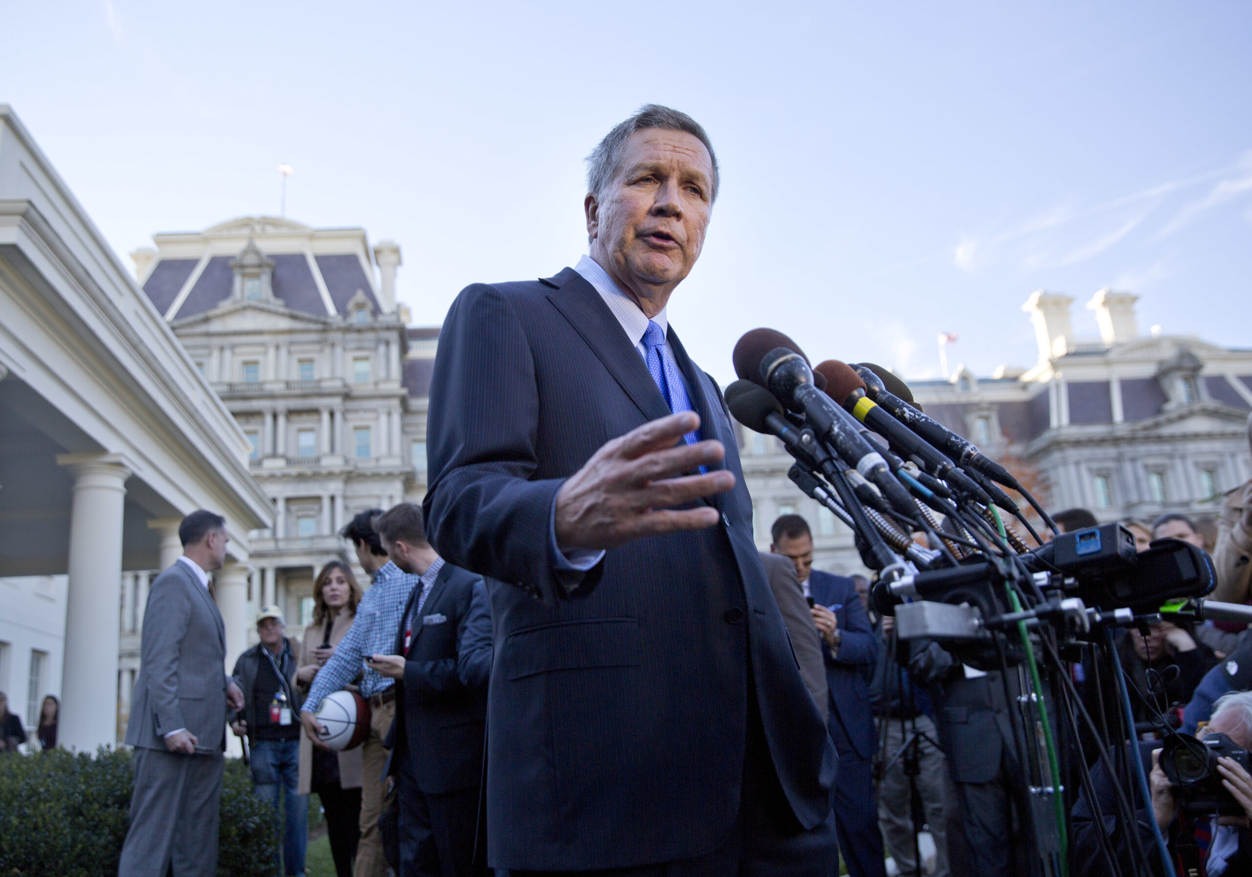 Ohio Gov. John Kasich answers questions from members of the media outside the West Wing of the White House in Washington, Thursday, Nov. 10, 2016, after attending a ceremony on the South Lawn where President Barack Obama honored the 2016 NBA champion Cleveland Cavaliers basketball team. (AP Photo/Pablo Martinez Monsivais) (AP)