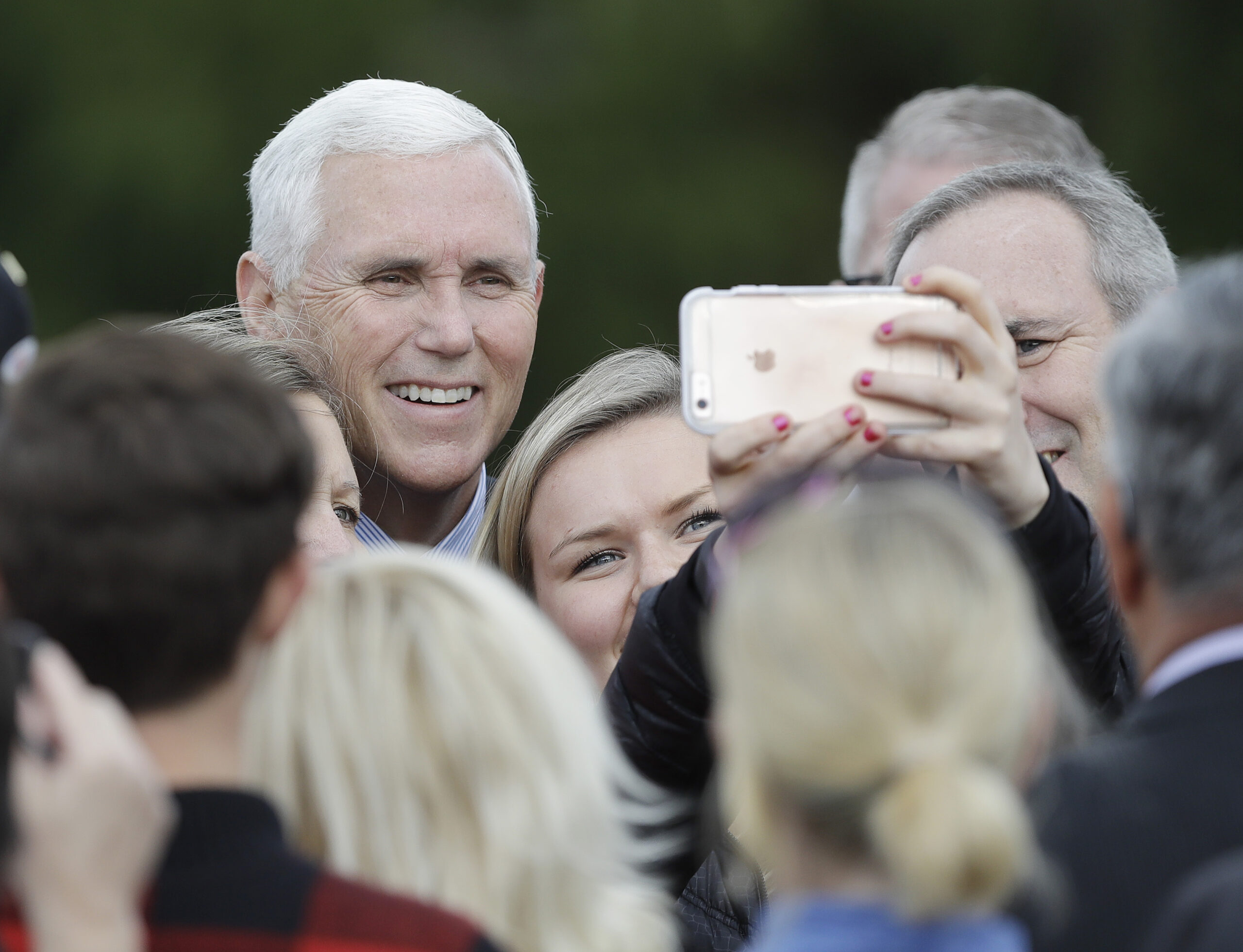 Vice President-elect Mike Pence poses for photos after speaking at a Veterans Day ceremony at Camp Atterbury in Edinburgh, Ind., Friday, Nov. 11, 2016. (AP Photo/Darron Cummings) (AP)
