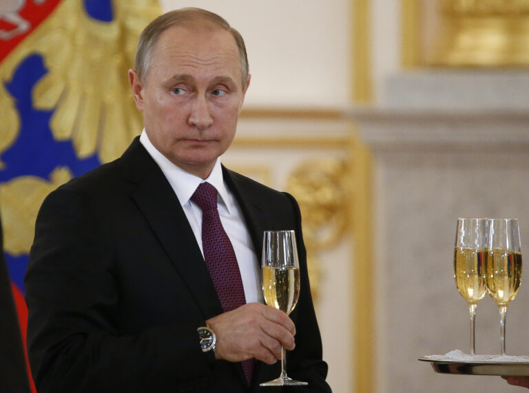 In this Nov. 9, 2016, photo, Russian President Vladimir Putin makes a toast during a ceremony for receiving diplomatic credentials from foreign ambassadors in the Kremlin in Moscow, Russia. In careful phrasing befitting the spy he once was, Vladimir Putin has made it clear he expects a great deal from President-elect Donald Trump. And, the billionaire businessman may expect a transactional relationship with Putin. (Sergei Karpukhin/Pool photo via AP) (AP)