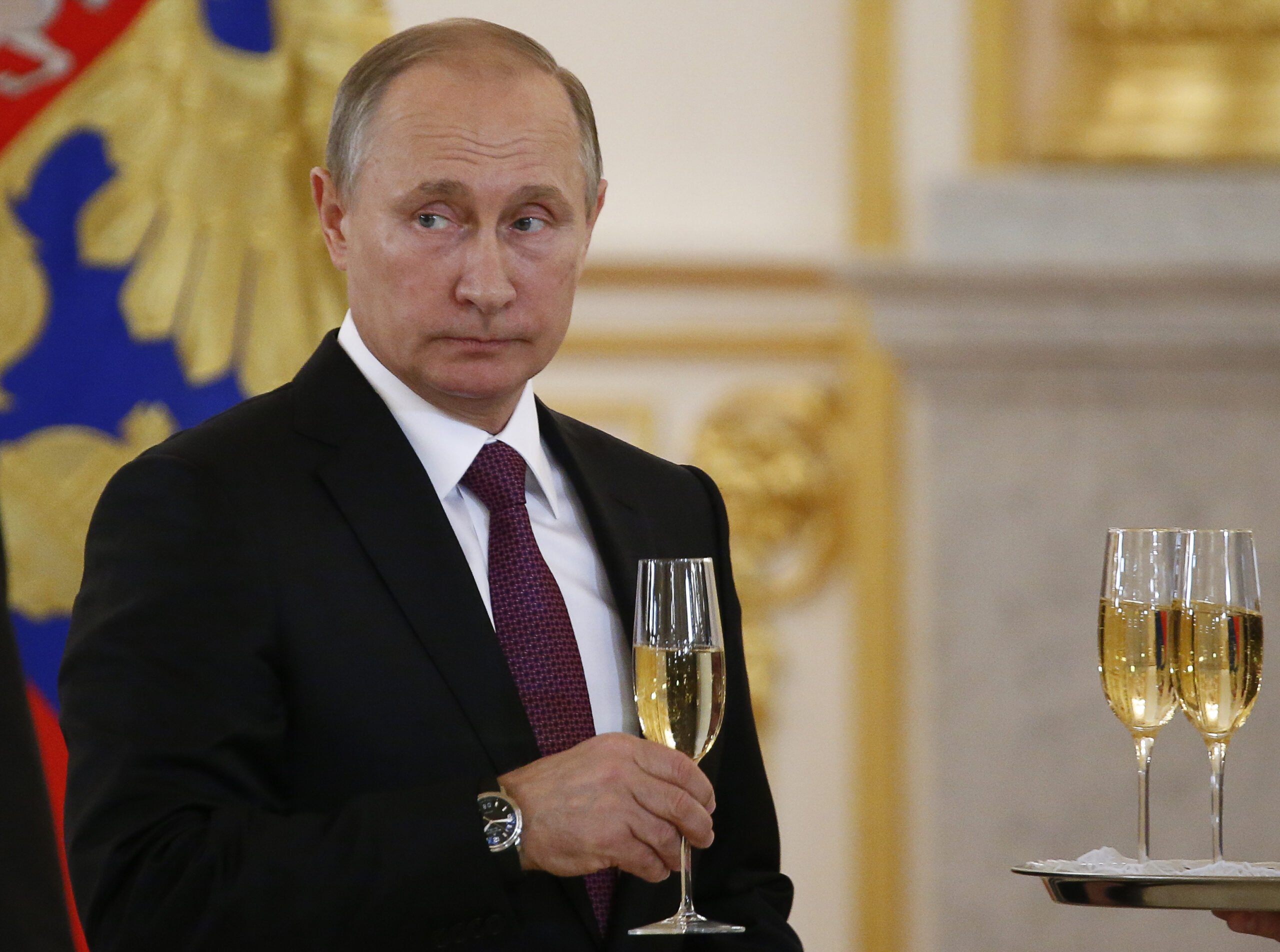 In this Nov. 9, 2016, photo, Russian President Vladimir Putin makes a toast during a ceremony for receiving diplomatic credentials from foreign ambassadors in the Kremlin in Moscow, Russia. In careful phrasing befitting the spy he once was, Vladimir Putin has made it clear he expects a great deal from President-elect Donald Trump. And, the billionaire businessman may expect a transactional relationship with Putin. (Sergei Karpukhin/Pool photo via AP) (AP)