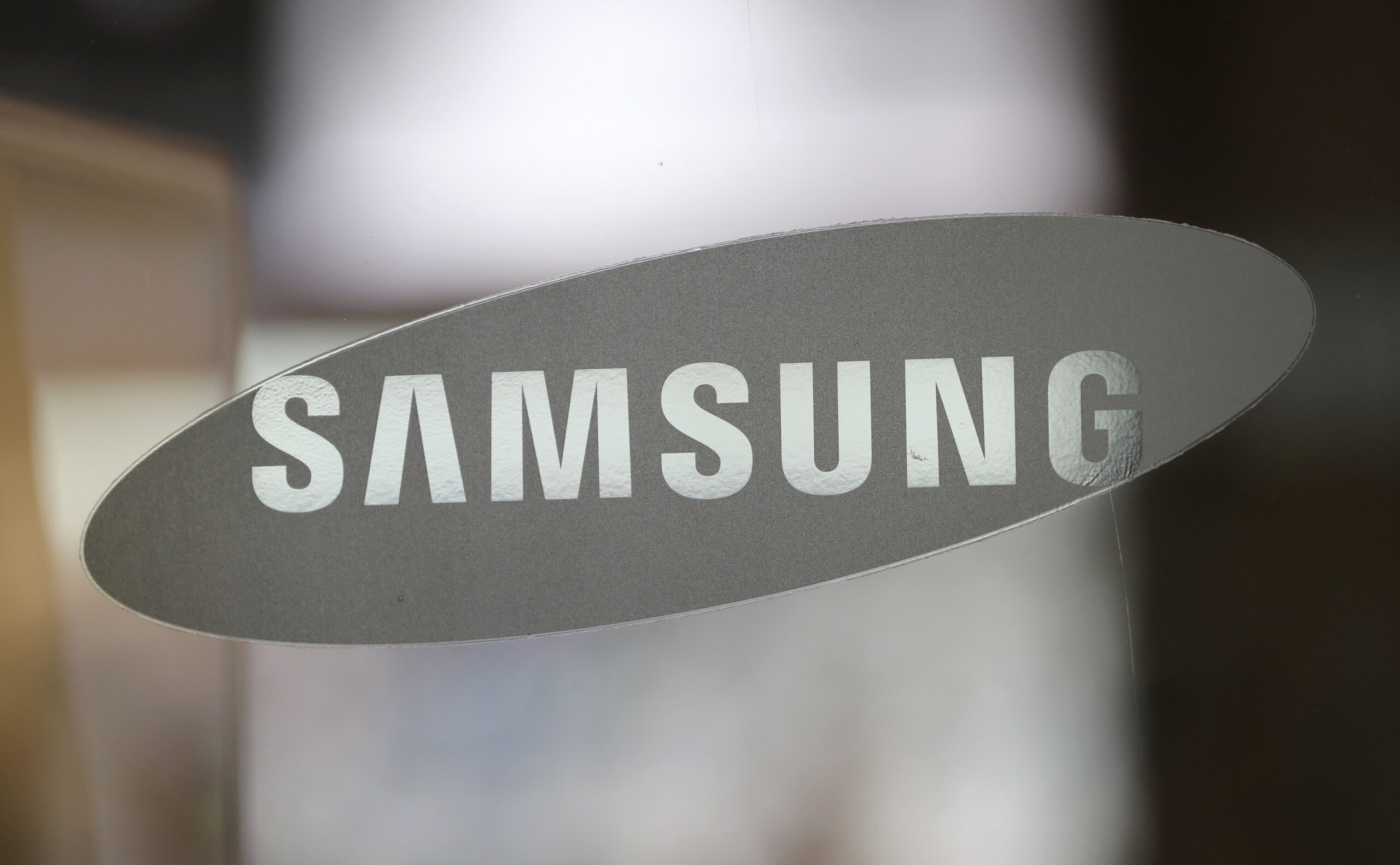 FILE - In this Oct. 5, 2016 file photo, the corporate logo of Samsung Electronics Co. is seen at its shop in Seoul, South Korea. Nearly 3 million Samsung washing machines are being recalled in the U.S. following multiple injuries, including a broken jaw, due to “excessive vibration.”  The recall Friday, Nov. 4,  affects 34 models of washing machines manufactured between 2011 and this year. (AP Photo/Lee Jin-man) (AP)