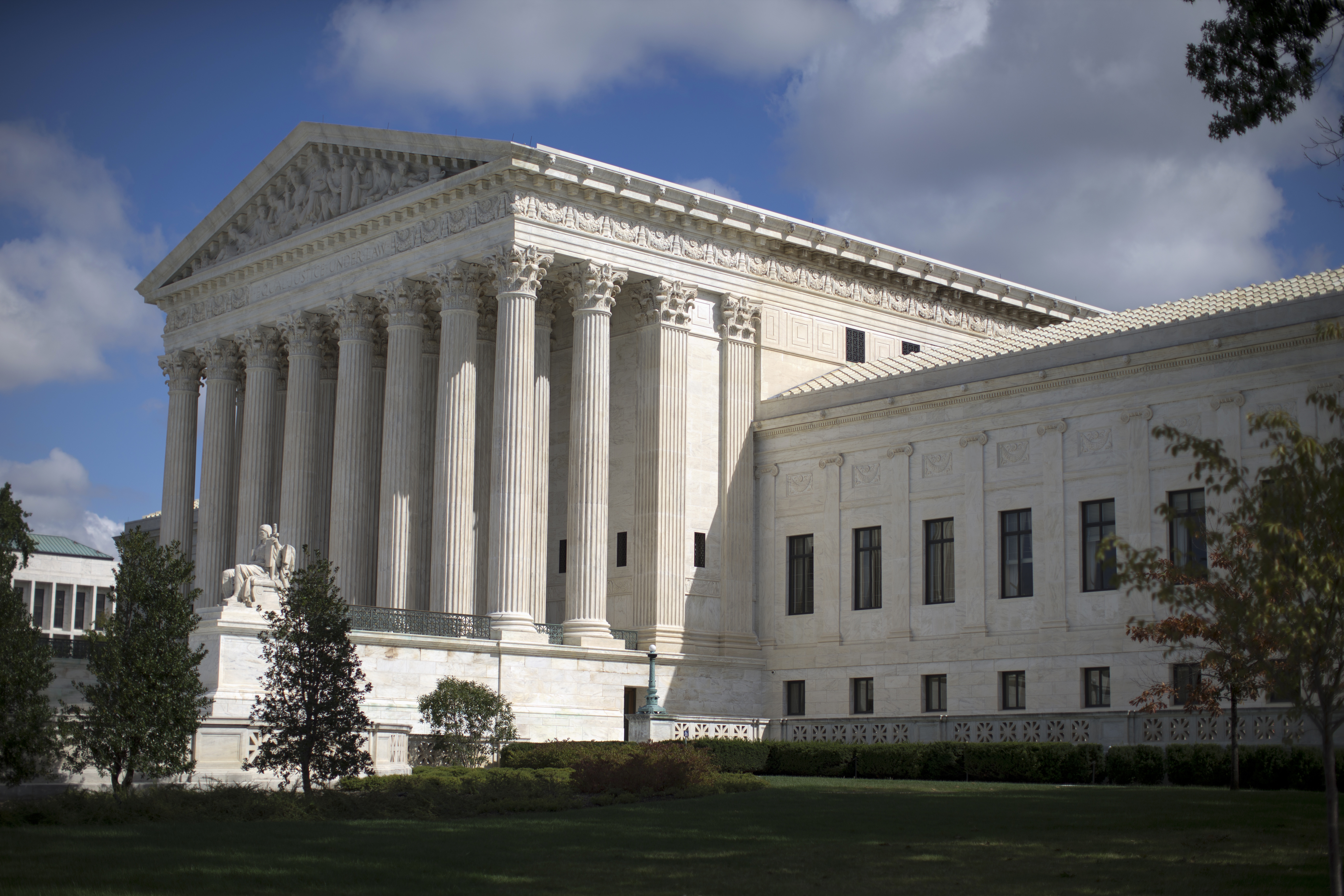 FILE - In this Oct. 5, 2015 file photo, the Supreme Court is seen in Washington. An Alabama death row inmate may be alive today because a transgender Virginia high school student was denied the use of the bathroom of his choice this year. The two seemingly unrelated cases have one thing in common: In each, a Supreme Court justice switched sides to provide a needed fifth vote to preserve the status quo.  (AP Photo/Carolyn Kaster, File) (AP)