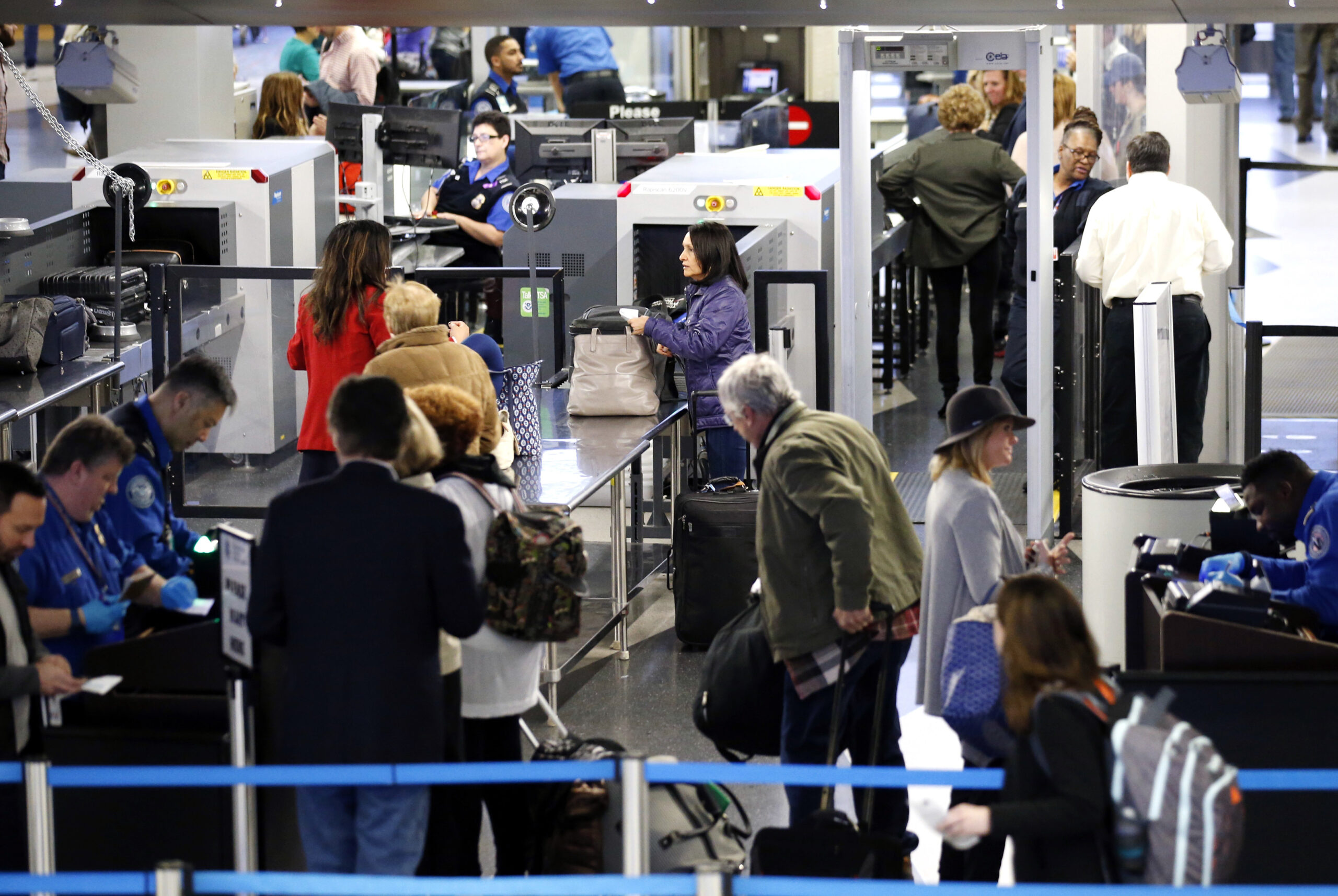 Travelers line up at a security checkpoint area in Terminal 3 at O'Hare International Airport in Chicago, Wednesday, Nov. 23, 2016.(AP Photo/Nam Y. Huh) (AP)