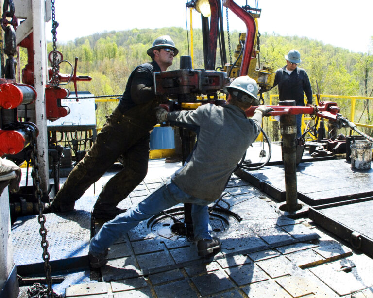 FILE- In this April 23, 2010 photo, workers move a section of well casing into place at a Chesapeake Energy natural gas well site near Burlington, Pa., in Bradford County. President-elect Donald Trump has not minced words about his approach to environment and energy policy: He loathes regulation, and wants to increase the use of coal, offshore drilling and fracking. (AP Photo/Ralph Wilson, File) (AP)