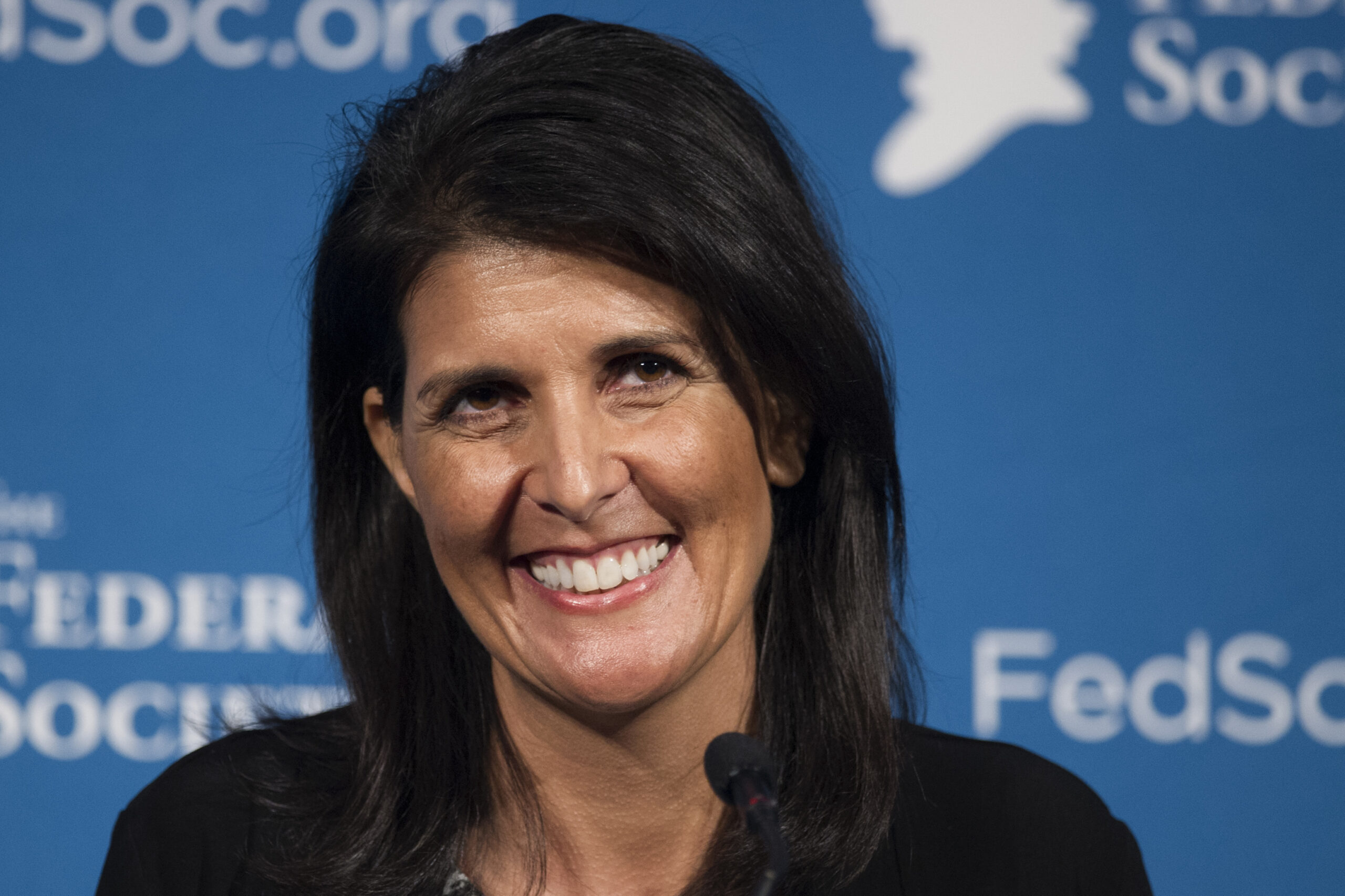 FILE - In this Friday, Nov. 18, 2016 photo, South Carolina Gov. Nikki Haley smiles while speaking at the Federalist Society's National Lawyers Convention in Washington. President-elect Donald Trump has chosen Haley as U.S. ambassador to the United Nations, and he will treat the ambassadorship as a Cabinet-level position, according to two sources familiar with Trump's decision who requested anonymity to discuss the decision and its announcement. Haley, an outspoken Trump critic throughout much of the presidential race, would become his first female - and first nonwhite - Cabinet-level official if confirmed by the Senate. (AP Photo/Cliff Owen, File) (AP)
