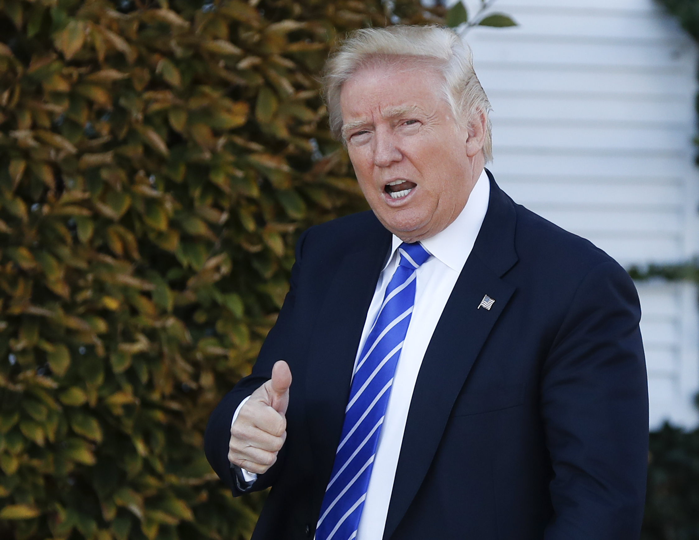 FILE - In this Saturday, Nov. 19, 2016 file photo, President-elect Donald Trump gives the thumbs-up as he arrive at the Trump National Golf Club Bedminster clubhouse in Bedminster, N.J. (AP)