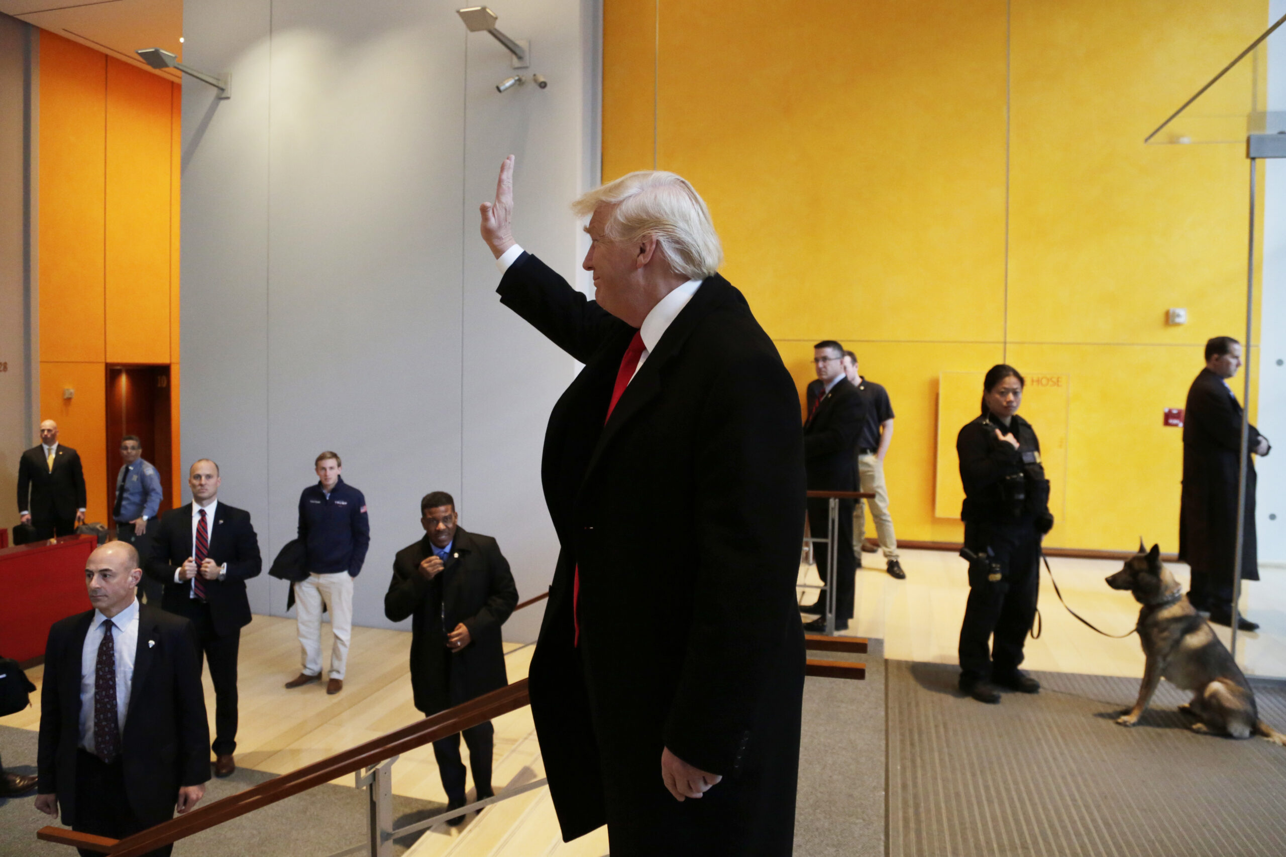 President-elect Donald Trump waves to a crowd in the lobby of the New York Times building following a meeting, Tuesday, Nov. 22, 2016, in New York. (AP)
