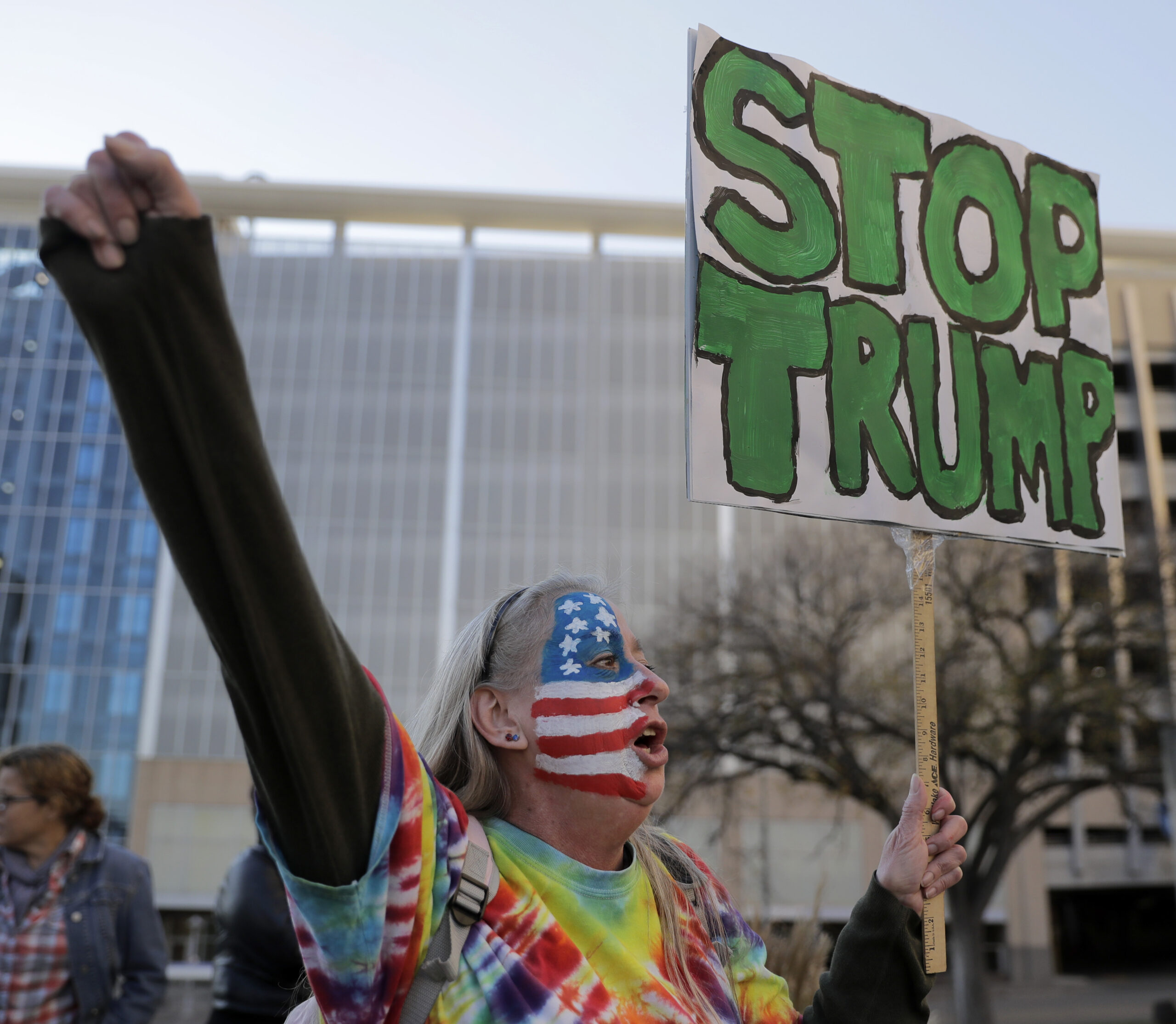 Mary Johnson protests against the election of President-elect Donald Trump Saturday, Nov. 12, 2016, in front of City Hall in Kansas City, Mo. (AP)