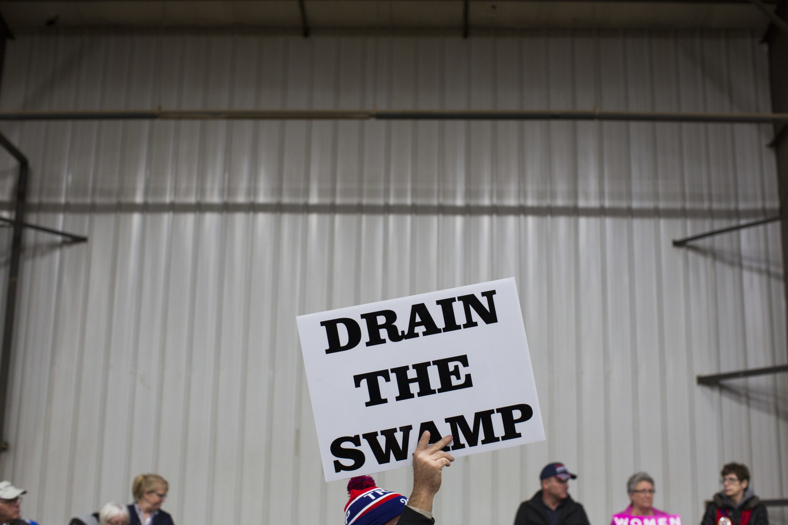 FILE - In this Oct. 27, 2016, file photo, supporters of then-Republican presidential candidate Donald Trump hold signs during a campaign rally in Springfield, Ohio. President-elect Donald Trump’s campaign promise to “drain the swamp” of Washington might make it difficult for him to fill all the jobs in his administration. () (AP Photo/ Evan Vucci, file)