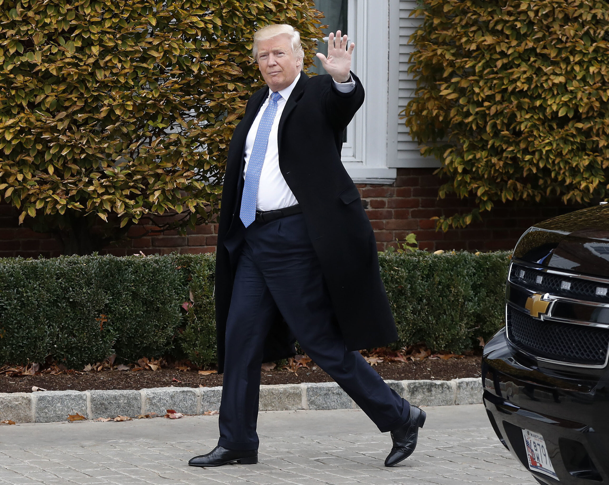 FILE - In this Nov. 20, 2016 file photo, President-elect Donald Trump waves as he arrives at the Trump National Golf Club Bedminster clubhouse in Bedminster, N.J. (AP)