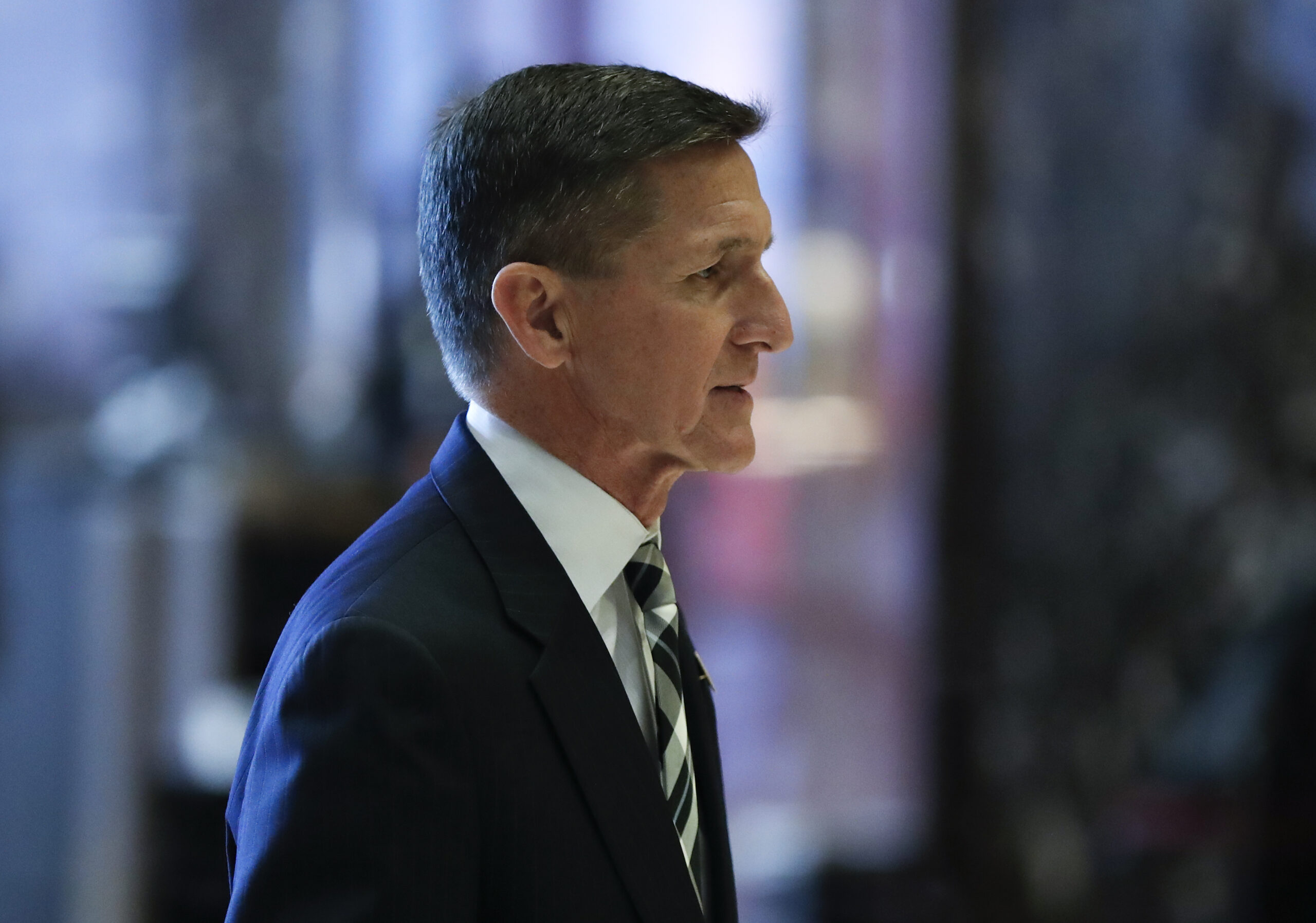 Retired Lt. Gen. Michael Flynn walks through the lobby at Trump Tower, Thursday, Nov. 17, 2016, in New York. (AP Photo/Carolyn Kaster)