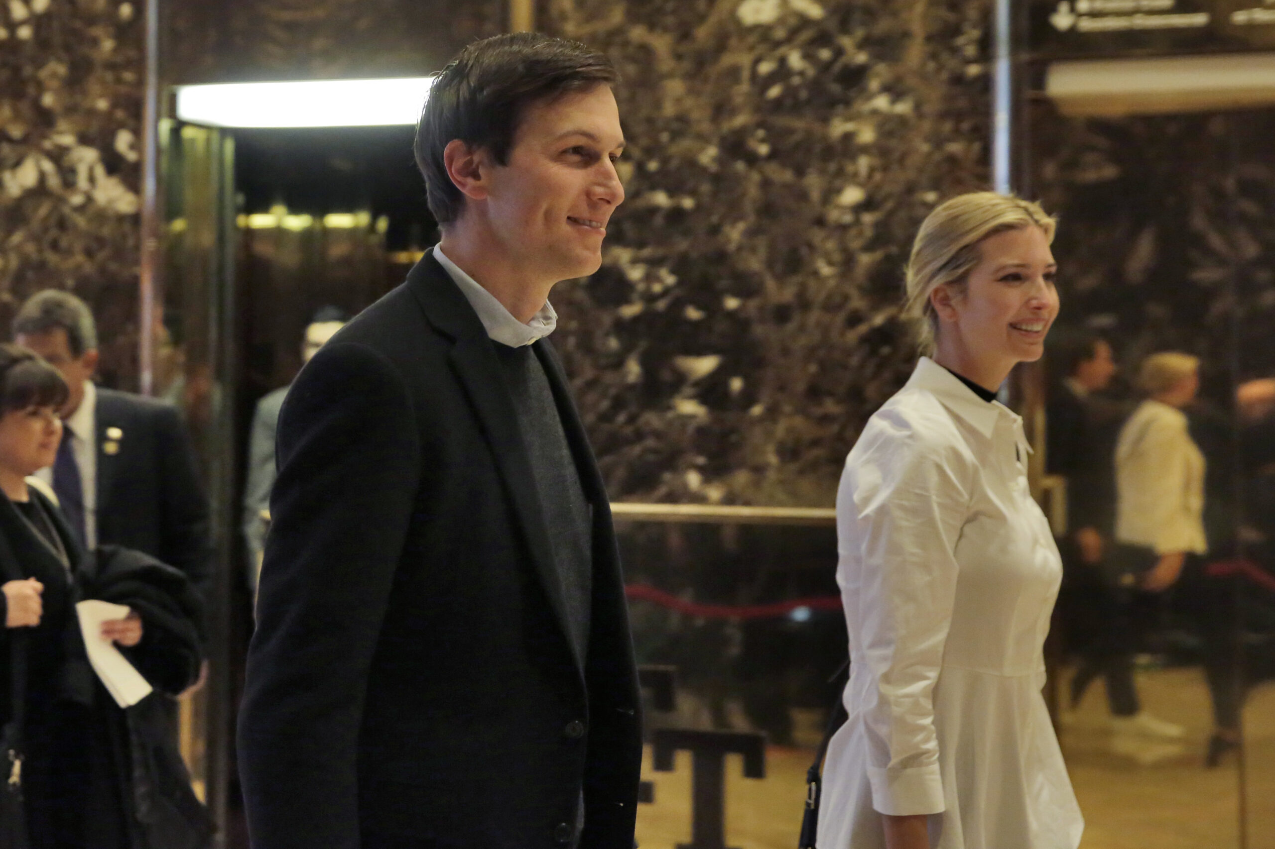 Jared Kushner and his wife Ivanka Trump walk through the lobby of Trump Tower in New York. (AP)