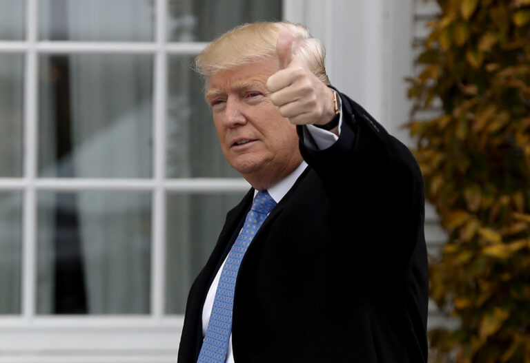 President-elect Donald Trump gives the thumbs up as he arrives at the Trump National Golf Club Bedminster clubhouse, Sunday, Nov. 20, 2016 in Bedminster, N.J.. (AP Photo/Carolyn Kaster) (AP)