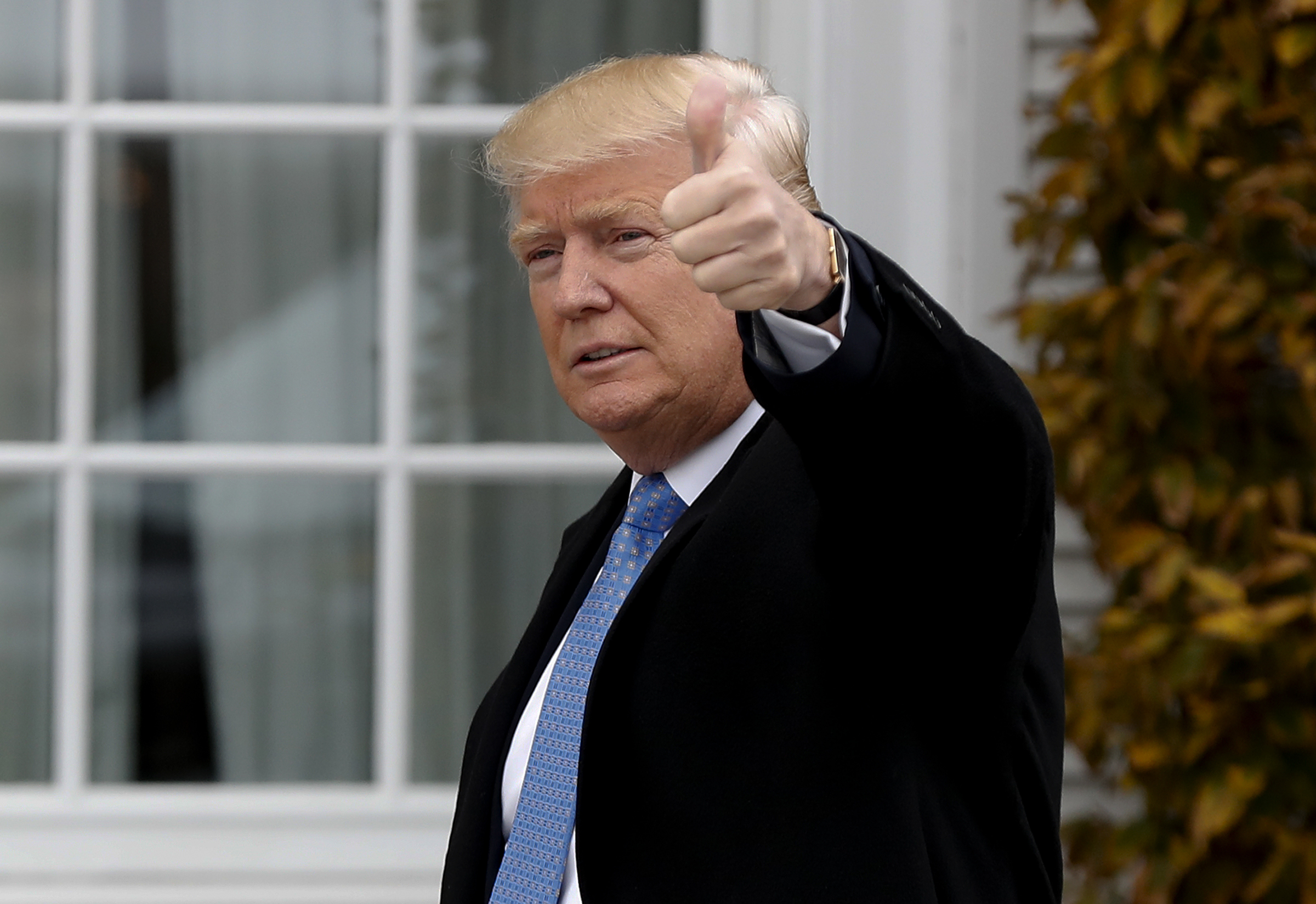 President-elect Donald Trump gives the thumbs up as he arrives at the Trump National Golf Club Bedminster clubhouse, Sunday, Nov. 20, 2016 in Bedminster, N.J.. (AP Photo/Carolyn Kaster) (AP)